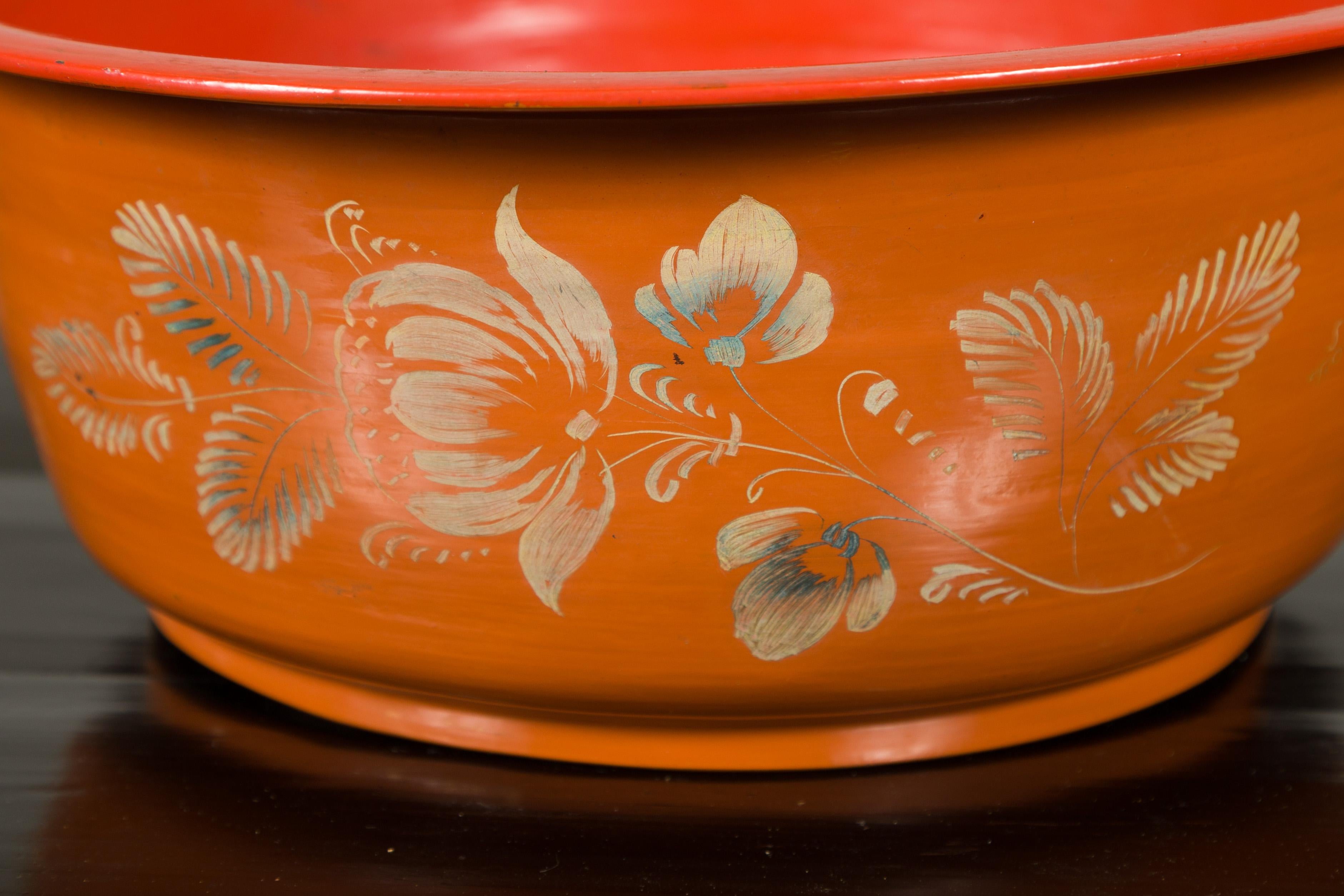 orange pyrex bowl with flowers