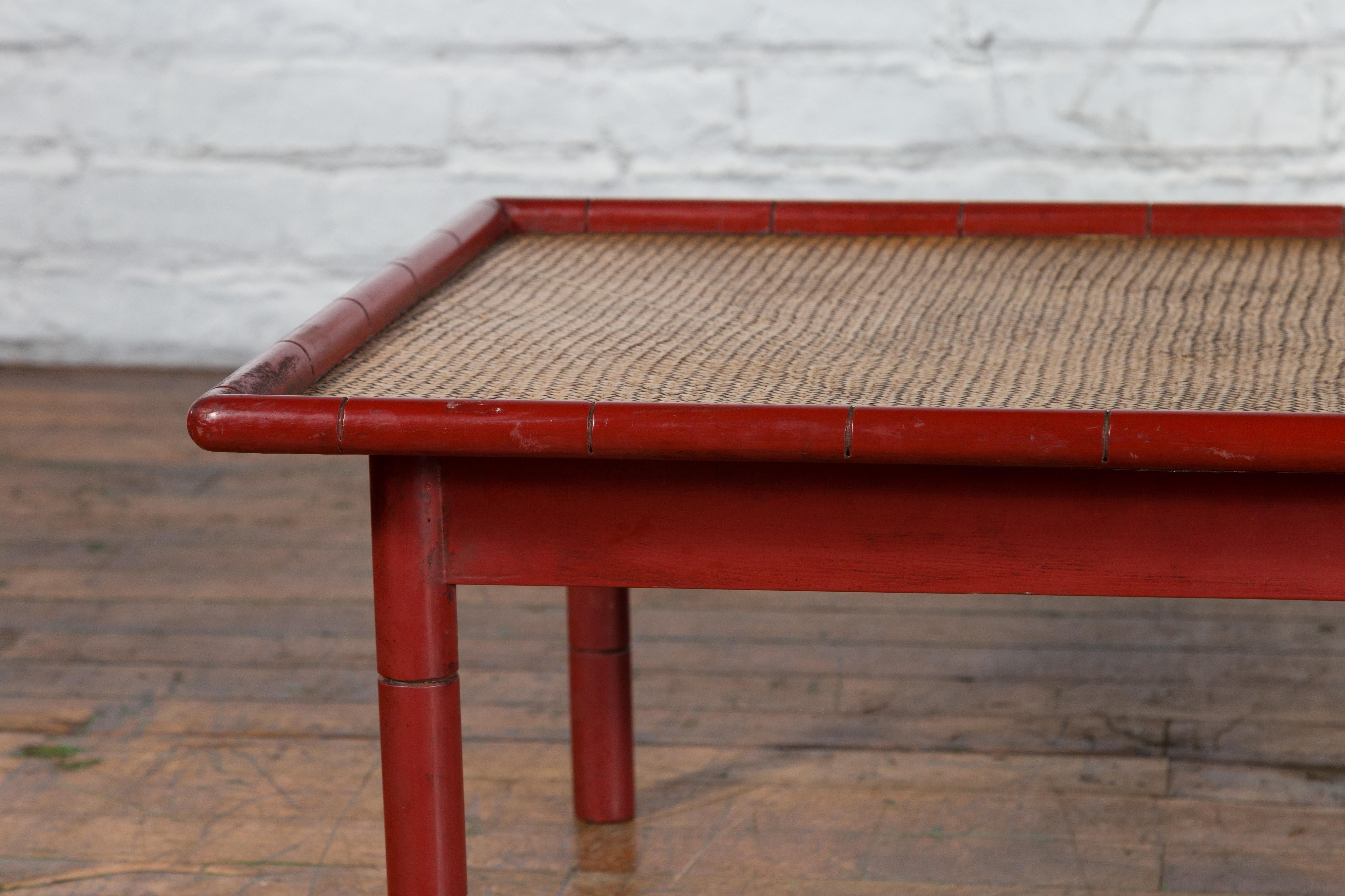 20th Century Vintage Burmese Red Lacquered Faux Bamboo Coffee Table with Woven Rattan Top For Sale