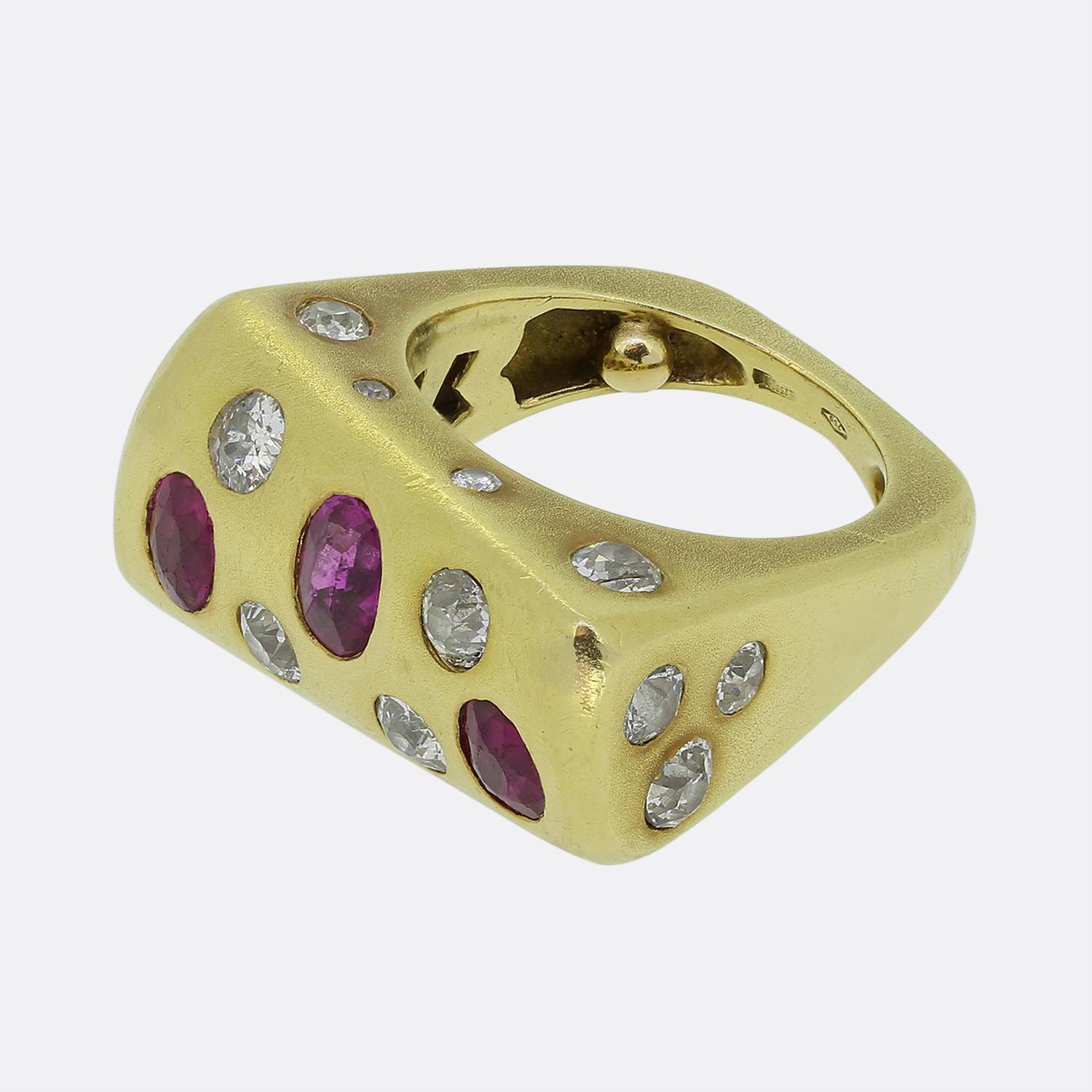 Here we have a wonderful and fun abstract ring that dates back to the 1970s. The ring has been exceptionally crafted in 18ct yellow gold and features an array of old cut diamonds and rich red Burmese rubies. The bold oblong design along with the