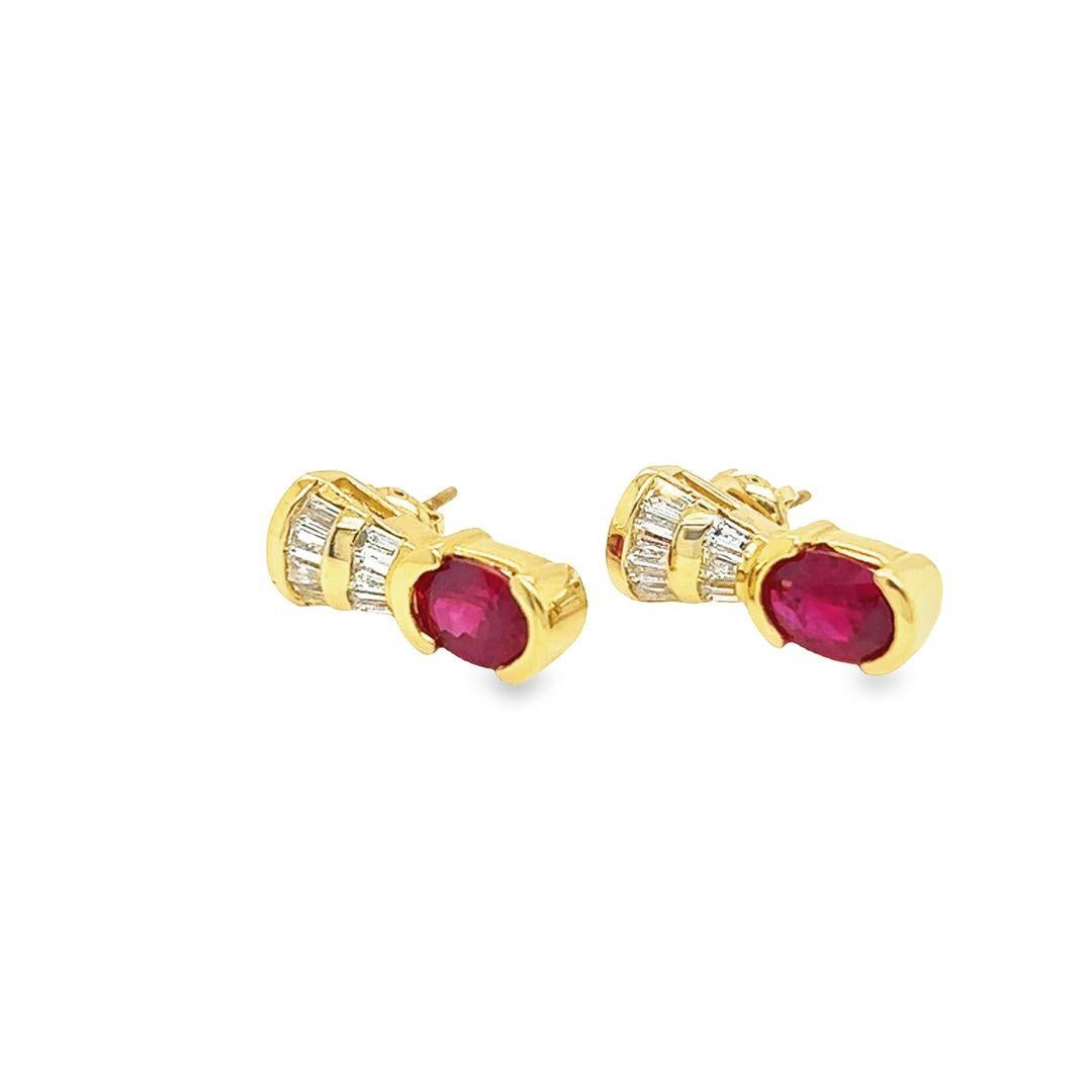 These exquisite Burmese Ruby and Diamond earrings feature stunning oval-shaped rubies, each weighing approximately 0.90 carats. The rubies are set in a half-bezel setting that creates a striking contrast against the 14K Yellow Gold.

These earrings