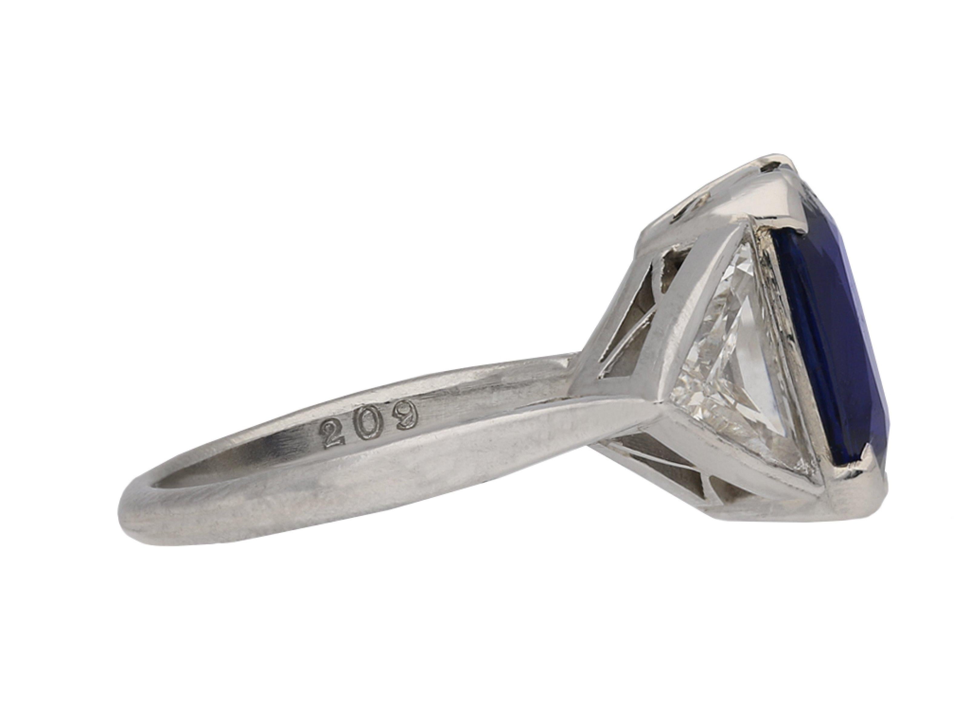 Vintage Burmese sapphire and diamond ring. Set to centre with a cushion shape old mine natural unenhanced Burmese sapphire in an open back claw setting with an approximate weight of 3.72 carats, flanked by two trillion step cut diamonds in open back