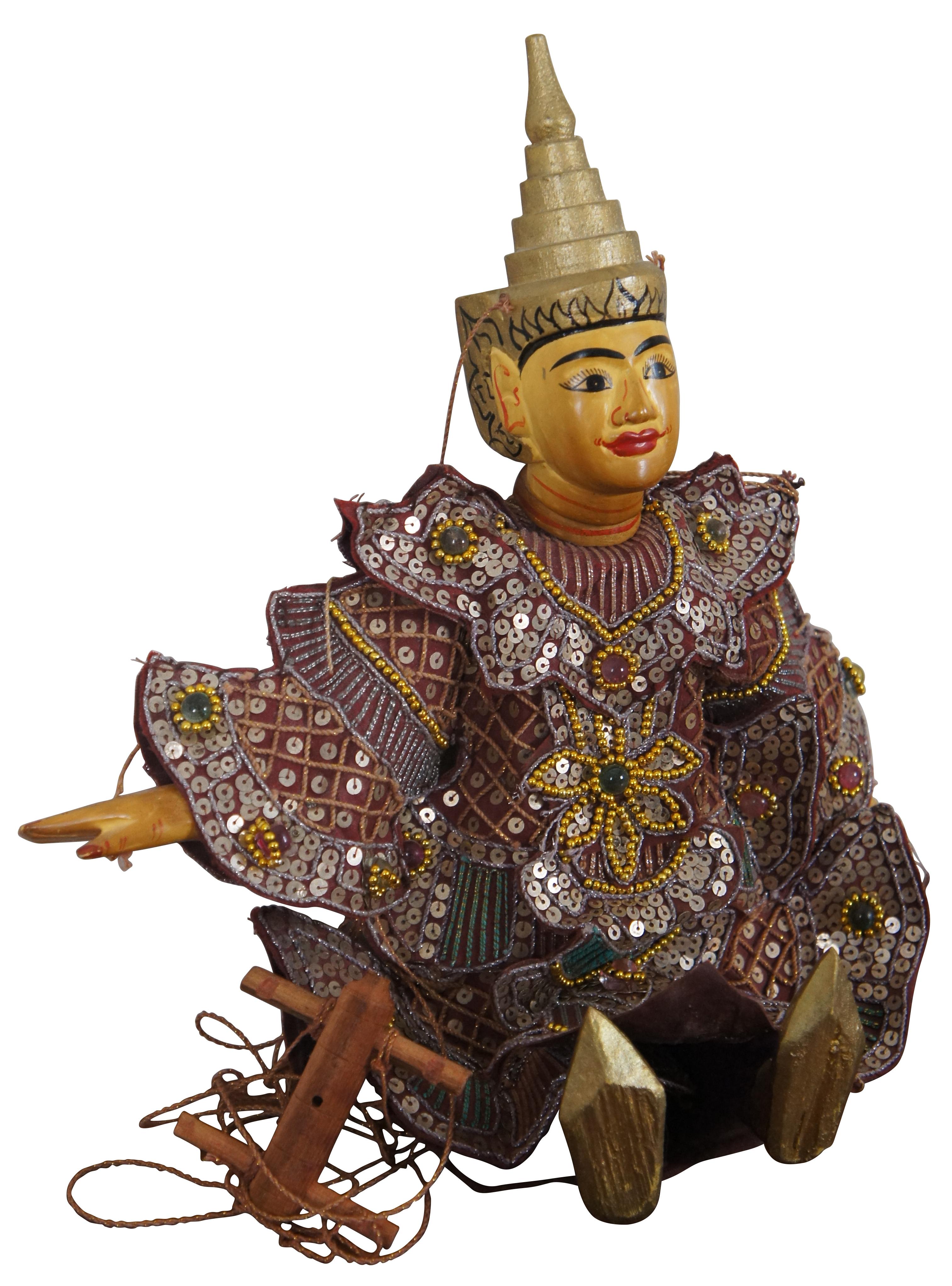 Vintage hand crafted, painted wooden marionette style puppet depicting Tha Gyar Min, King of the Celestial Beings of Myanmar / Burmese theater, fashioned with golden features and an intricately sequined outfit. Measure: 15