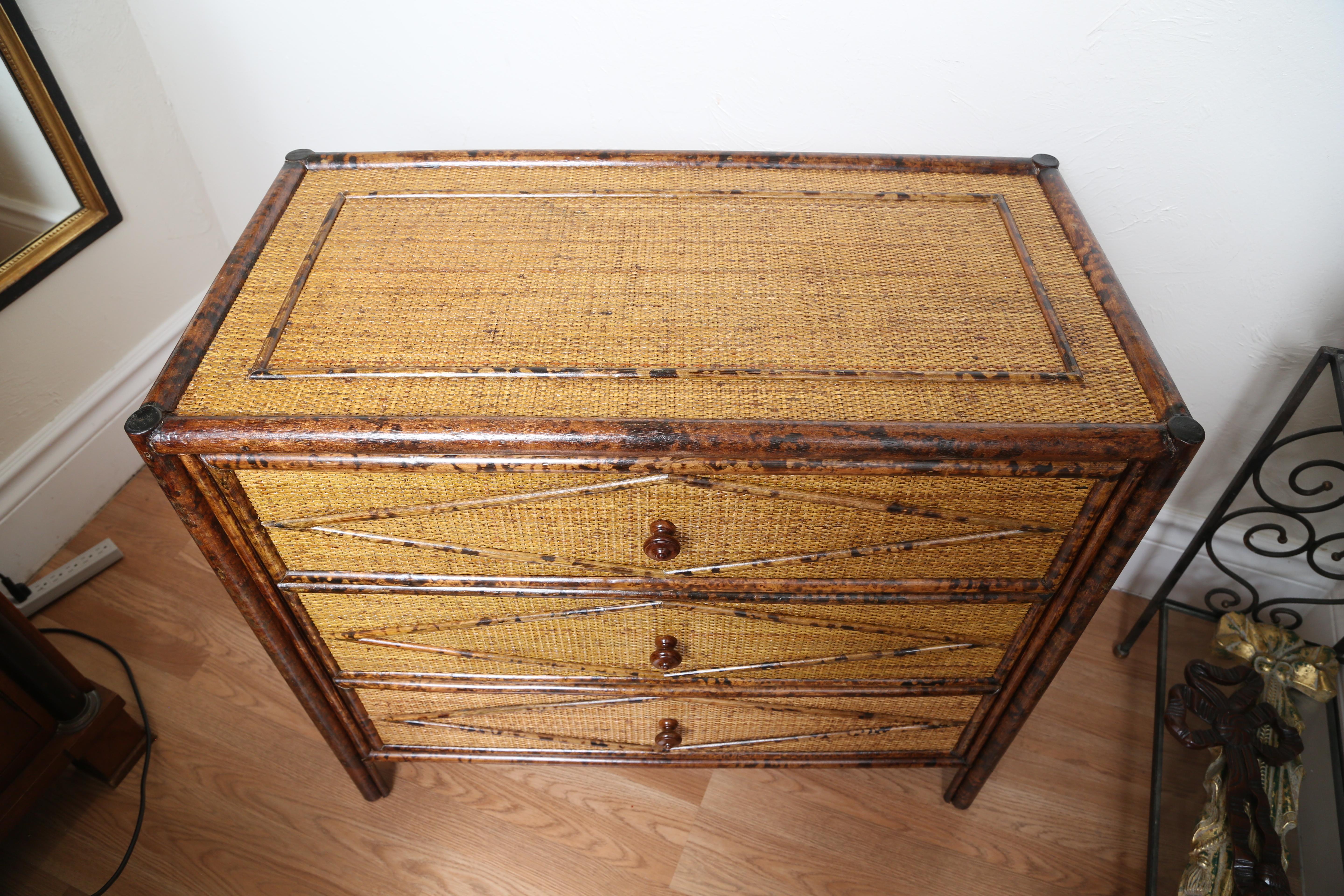 Vintage three-drawer burnt bamboo dresser.