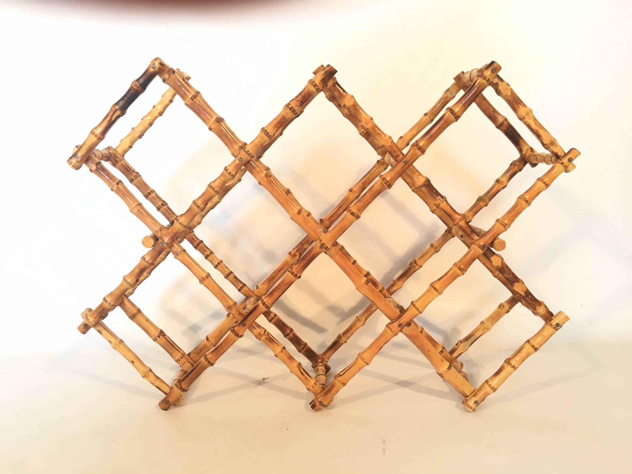 Vintage burnt bamboo wine rack holds ten bottles and collapses for storage. Excellent vintage condition.