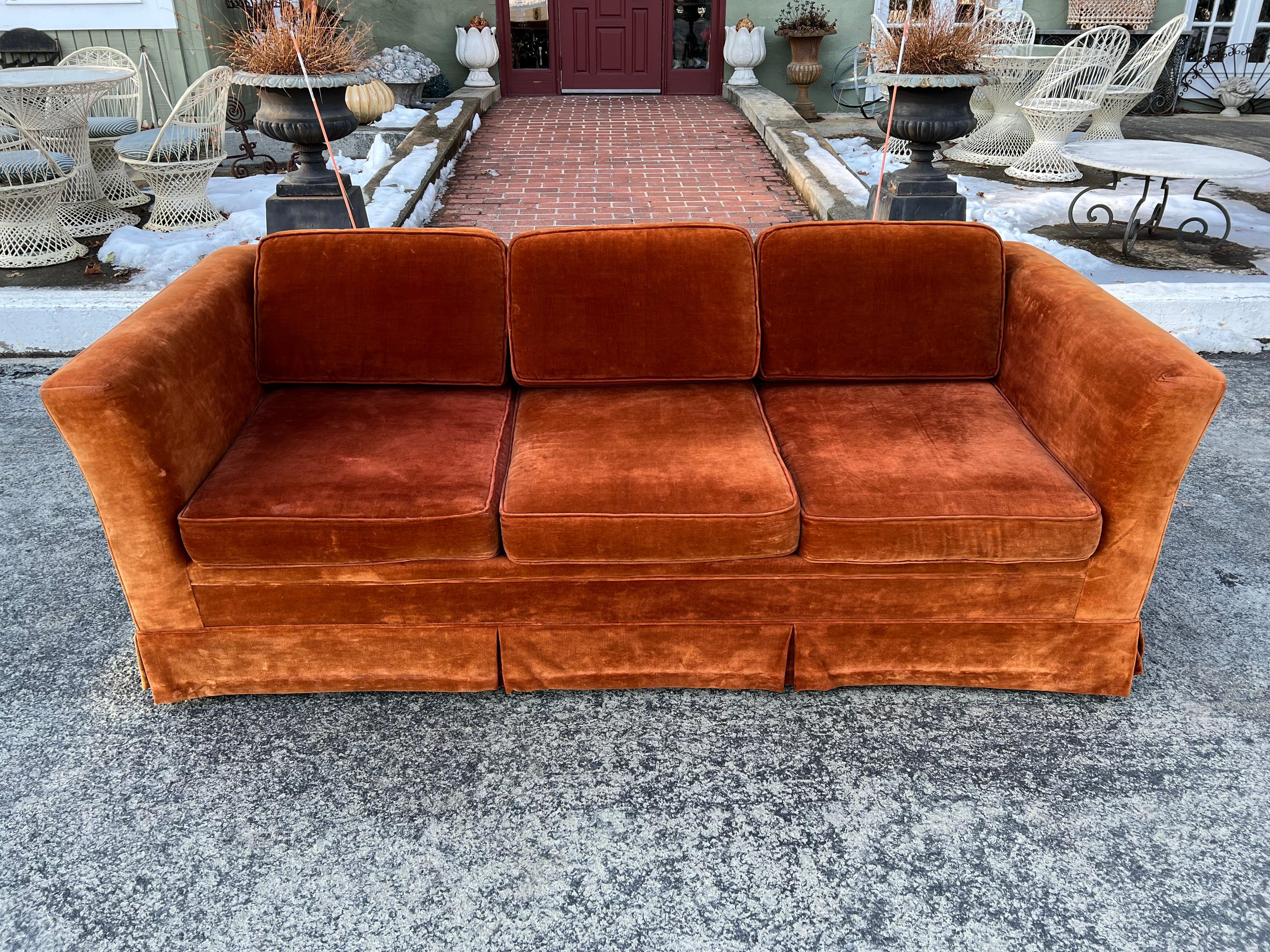 Vintage Velvet sofa in Burnt Orange. Classic tuxedo style sofa with clean minimalist lines. Sink into this luscious beauty . Overall very good vintage condition. 
Seat depth is 22