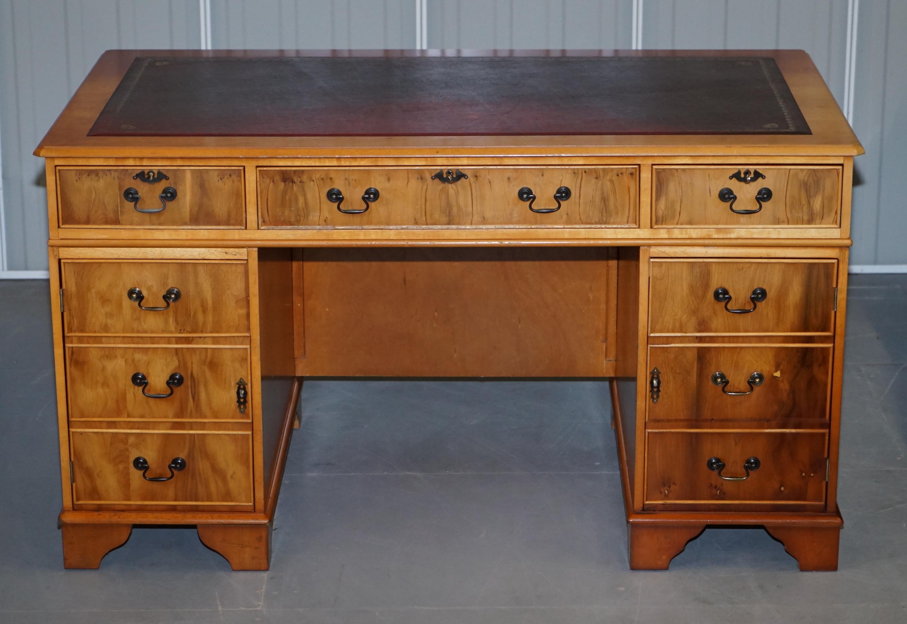 We are delighted to offer for sale this vintage Flamed & Burr Satinwood twin pedestal partner desk made with Oxblood leather writing surface and panelled back 

This is a good looking, well made and decorative piece, the cuts of timber are lovely