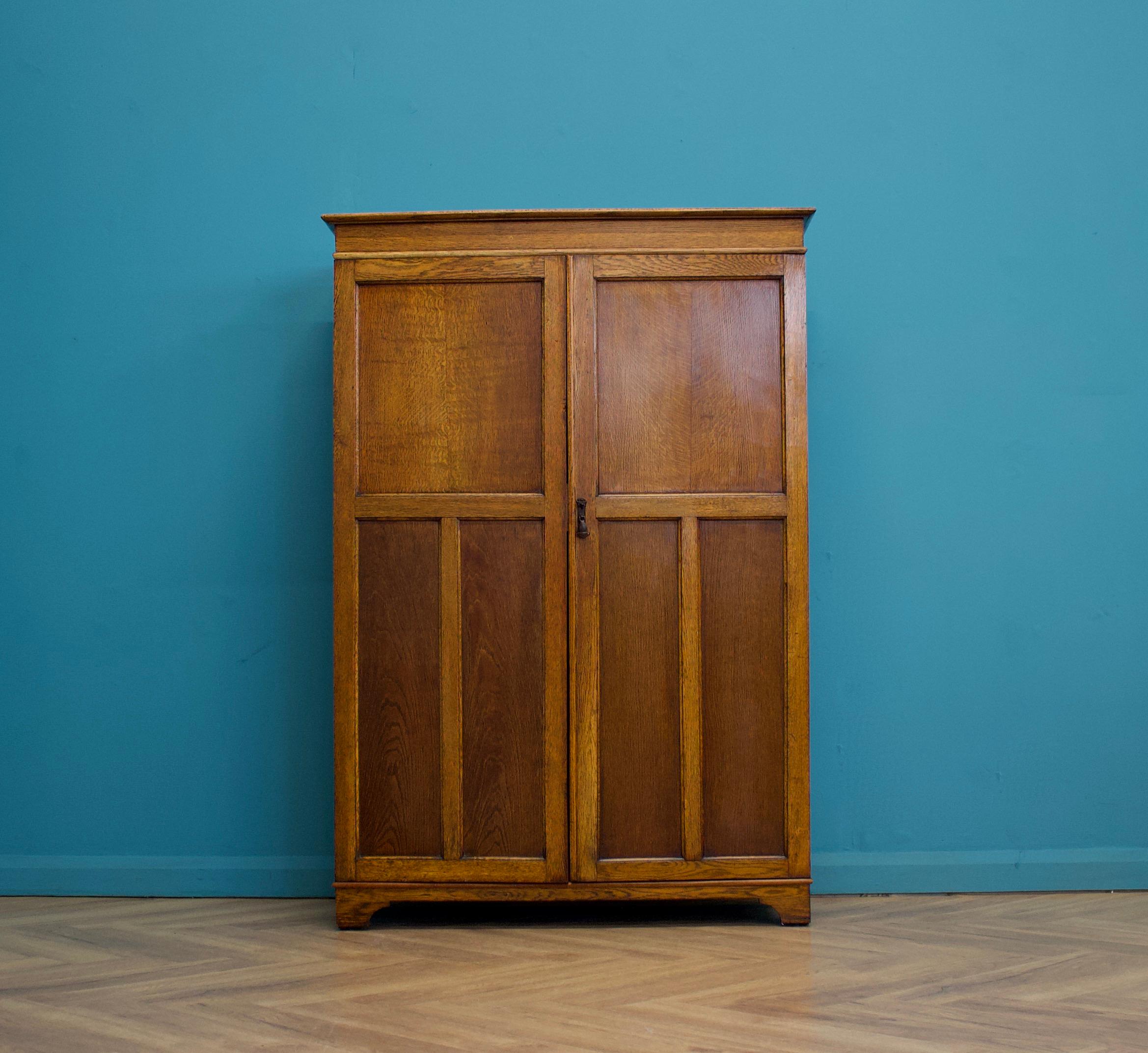 A vintage Oak Art Deco compactum / compact wardrobe 
Made circa 1930's 
Inside is fitted out with a pull out clothes rail, shelves , two drawers and a shoe rack