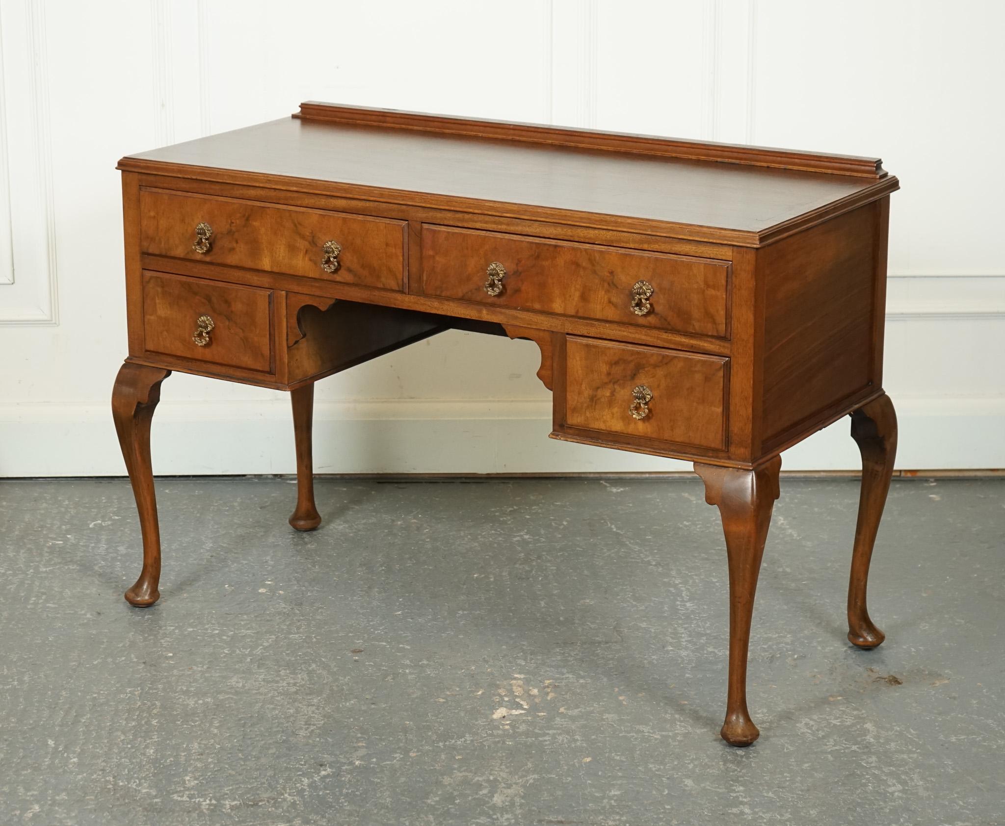 

We are delighted to offer for sale this Vintage Burr Walnut Dressing Table.

This vintage Burr Walnut dressing table desk, raised on Queen Anne legs, is a stunning piece that exudes elegance and sophistication. The use of Burr Walnut, known for