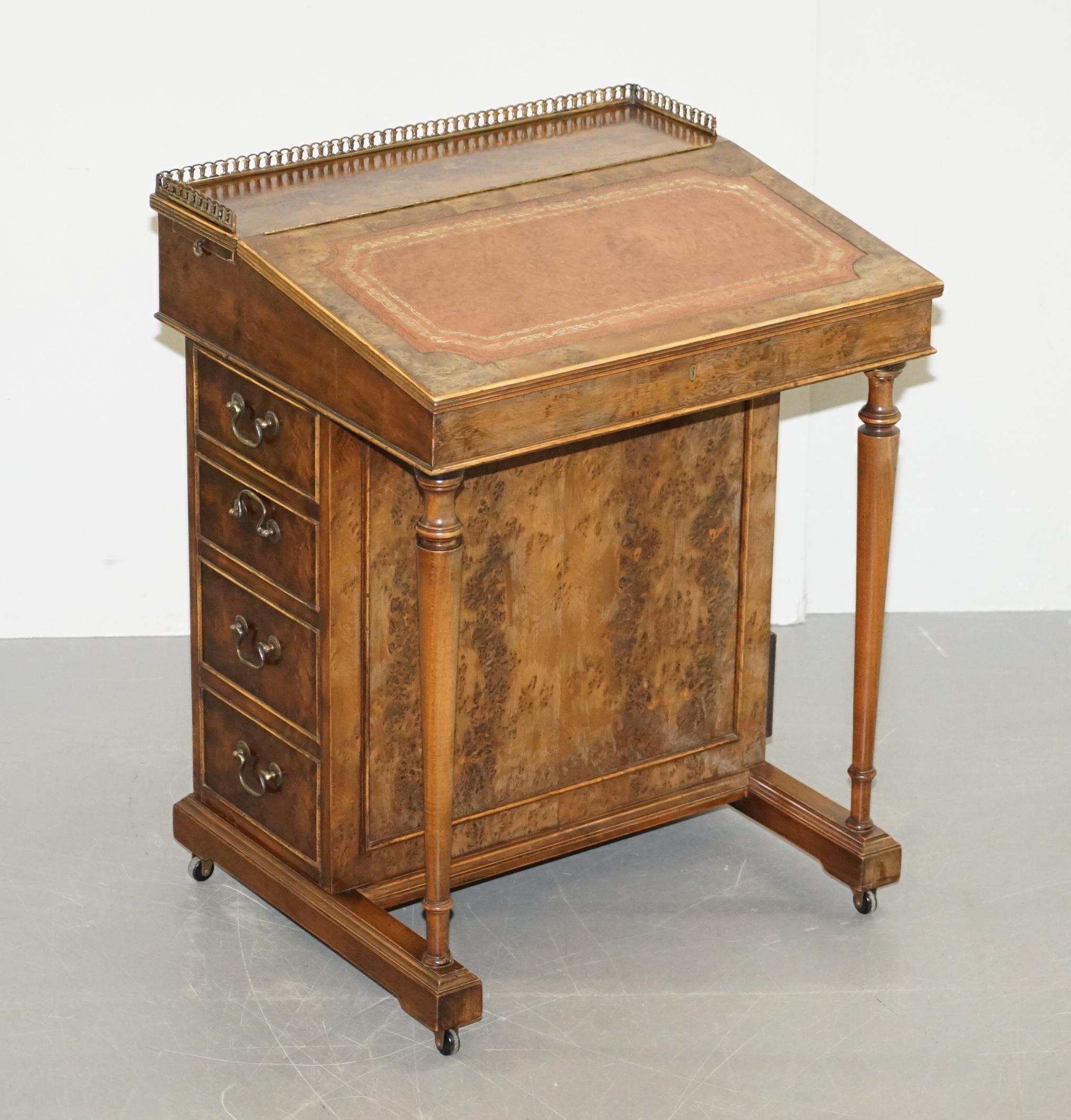 We are delighted to offer for sale this exquisite vintage burr walnut davenport desk with brown leather gold leaf tooled top and brass gallery rail.

A very well made piece, ideally suited as a laptop work station in a modern context. You have two