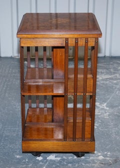 VINTAGE BURR WALNUT TOP REVOLVING BOOKCASE RAiSED ON CASTORS