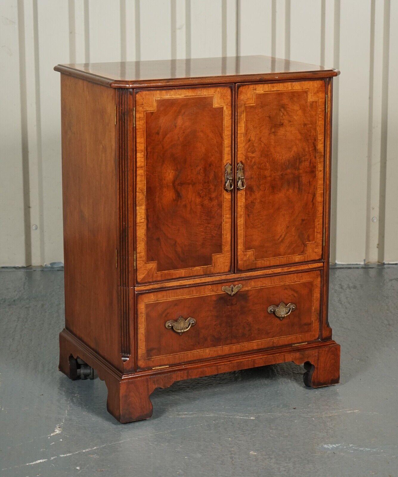 We are so excited to present to you this Beautiful Burr Walnut Tv Cabinet. 

A very well made and good looking decorative piece perfect hiding a Tv, Hifi etc.

We have lightly restored this by giving it a hand clean all over, hand waxed and hand