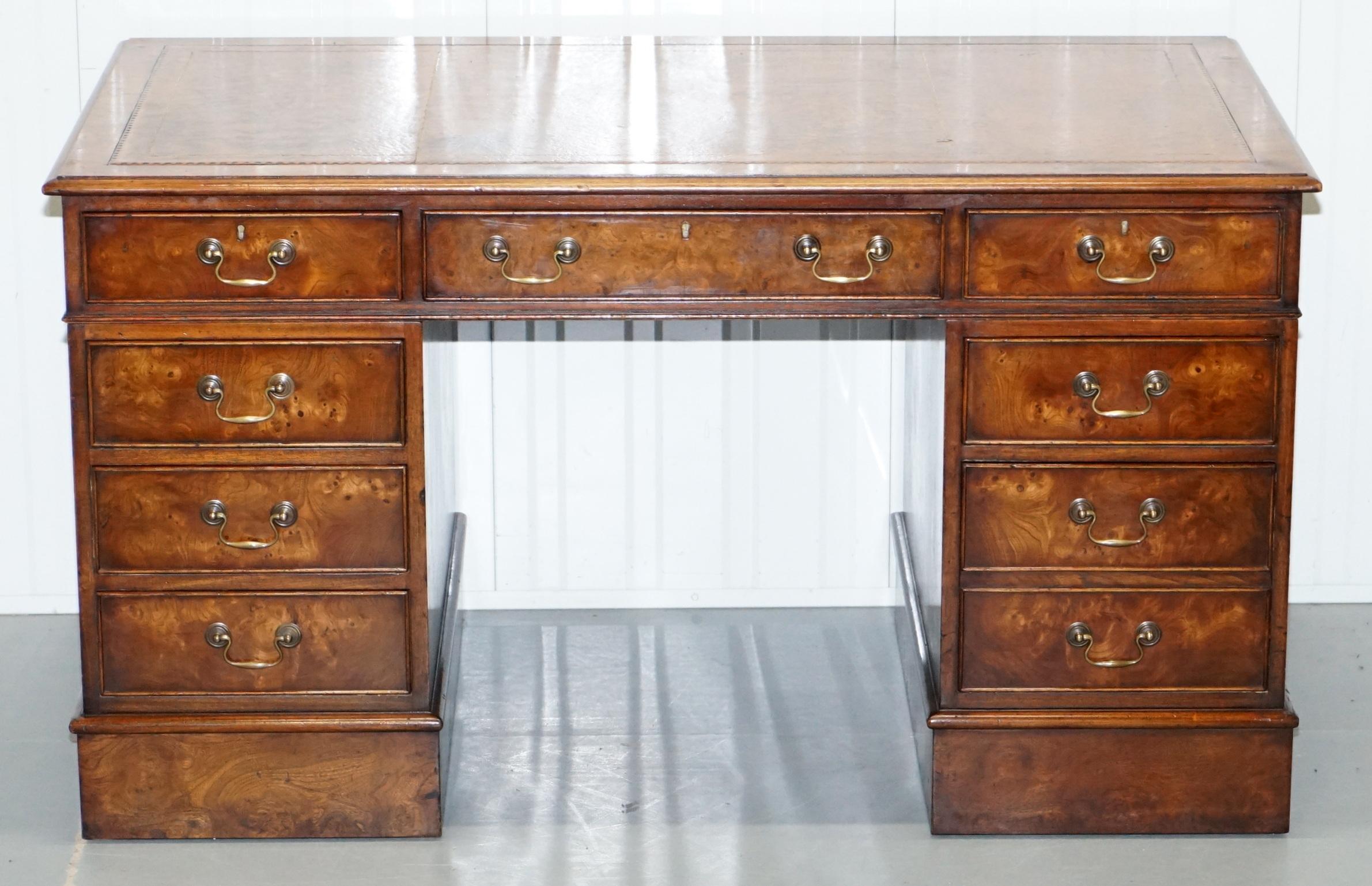 We are delighted to offer for sale this lovely vintage burr walnut twin pedestal partner desk with gold-tooled brown leather writing surface

This desk has the tradition drawer formation which is all standard drawers and one bottom right double