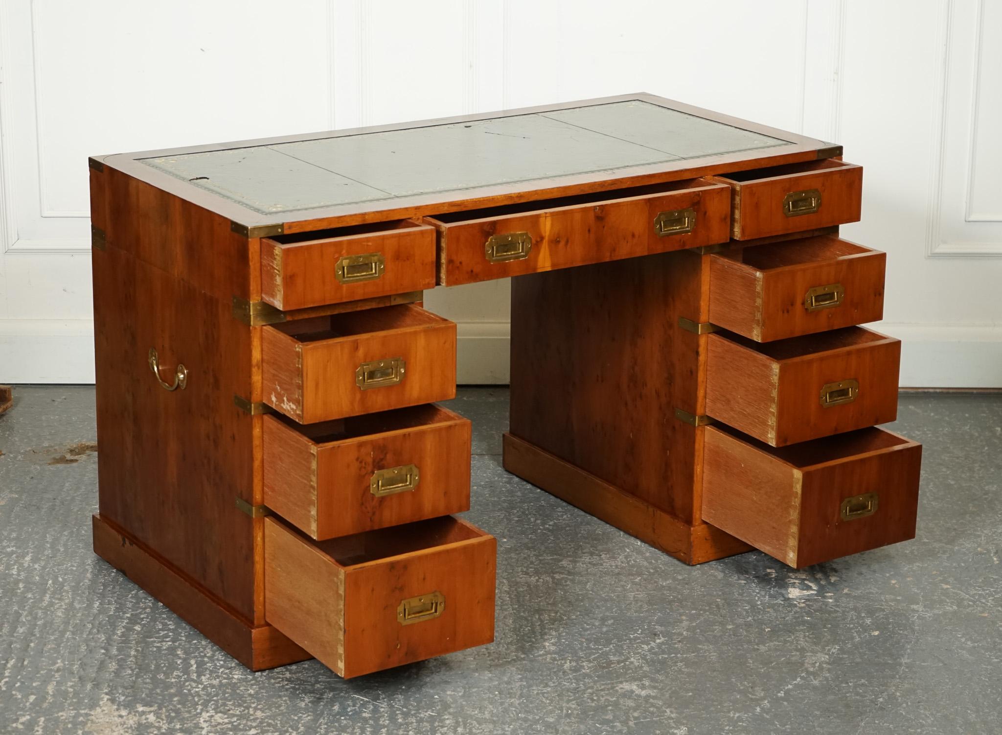 
We are delighted to offer for sale this Vintage Burr Yew Wood Campaign Military Green Leather Twin Pedestal Desk with Brass Fittings.

 A stunning and unique piece of furniture that exudes elegance and sophistication. The desk is crafted from burr