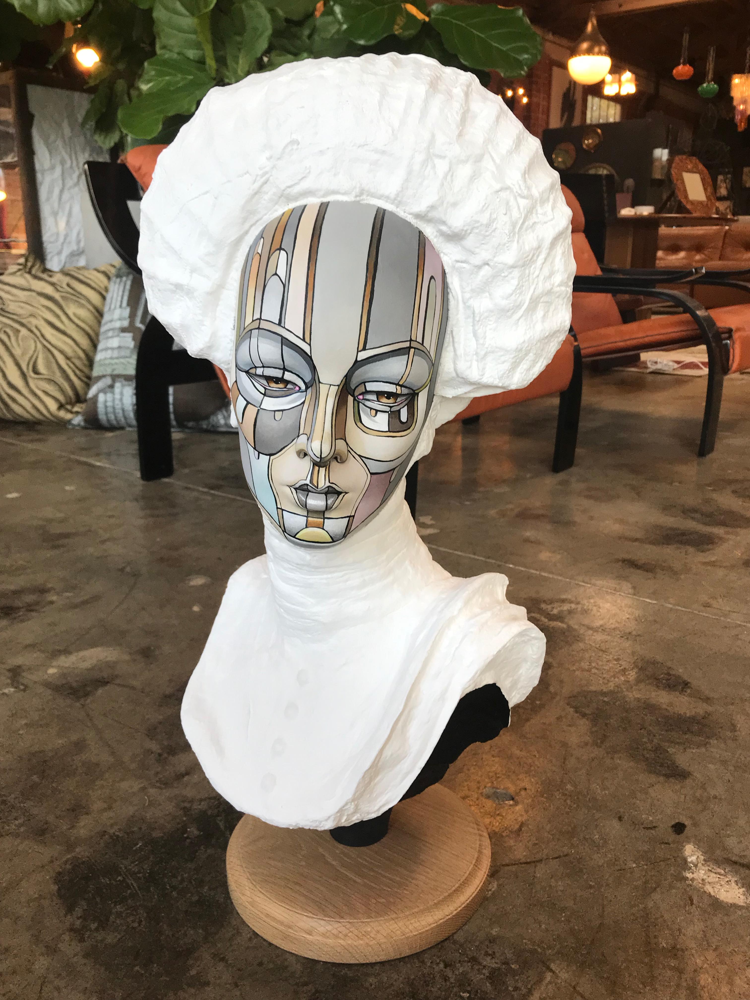 Bust of a young women, Signed David Gilmore, USA, 2019.
Each bust started with a vintage mannequin head which was then placed on either a metal or glass Stand. The artist, David Gilmore, painted a pattern over their faces in a similar manner to his