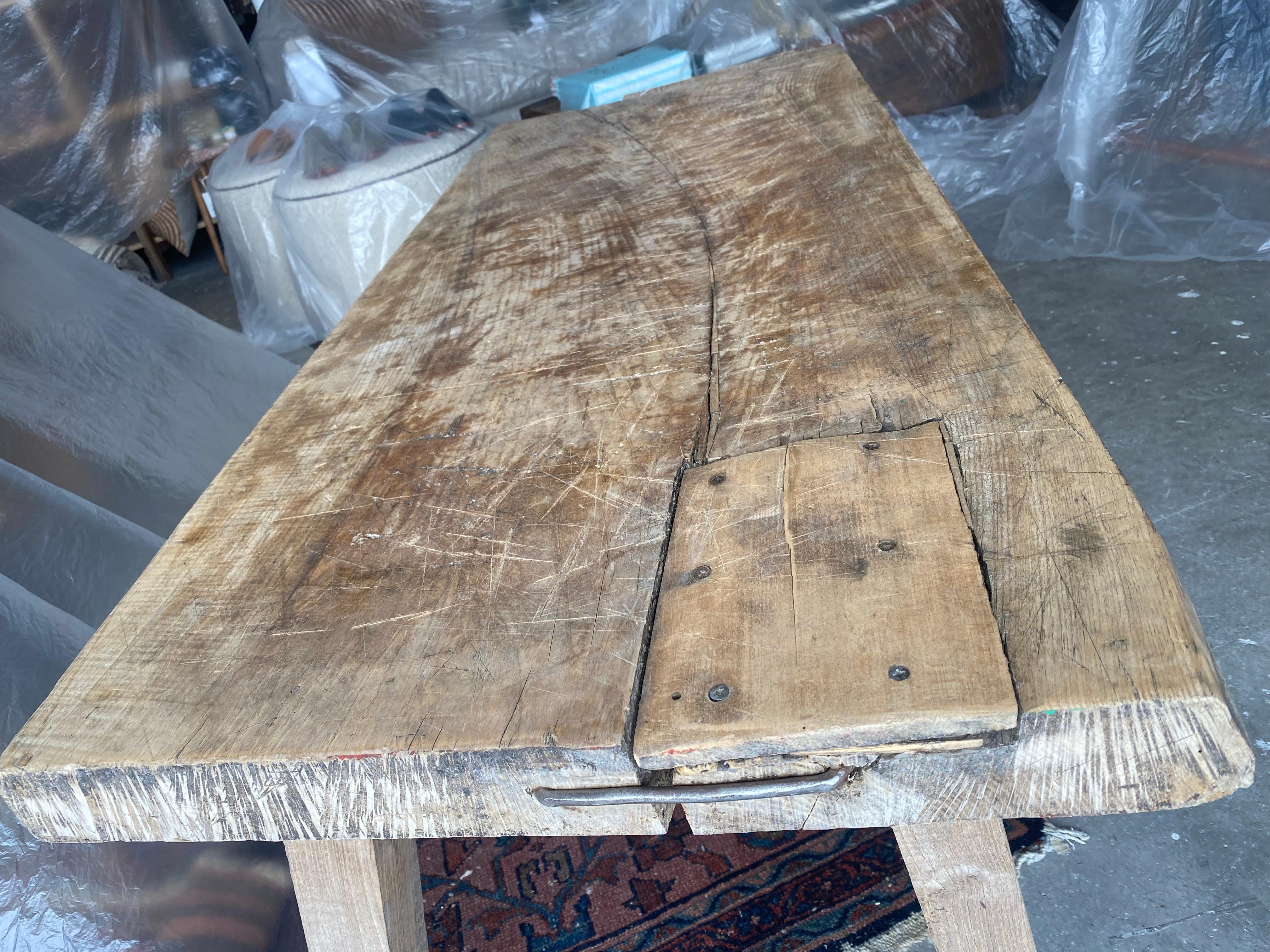 This stunning butcher block has beautiful metal accents, and gorgeous detailing showing its previous use dating back to the mid-2th century. It's short stature gives it the perfect coffee table vibe for a rustic home. Its in amazing condition with