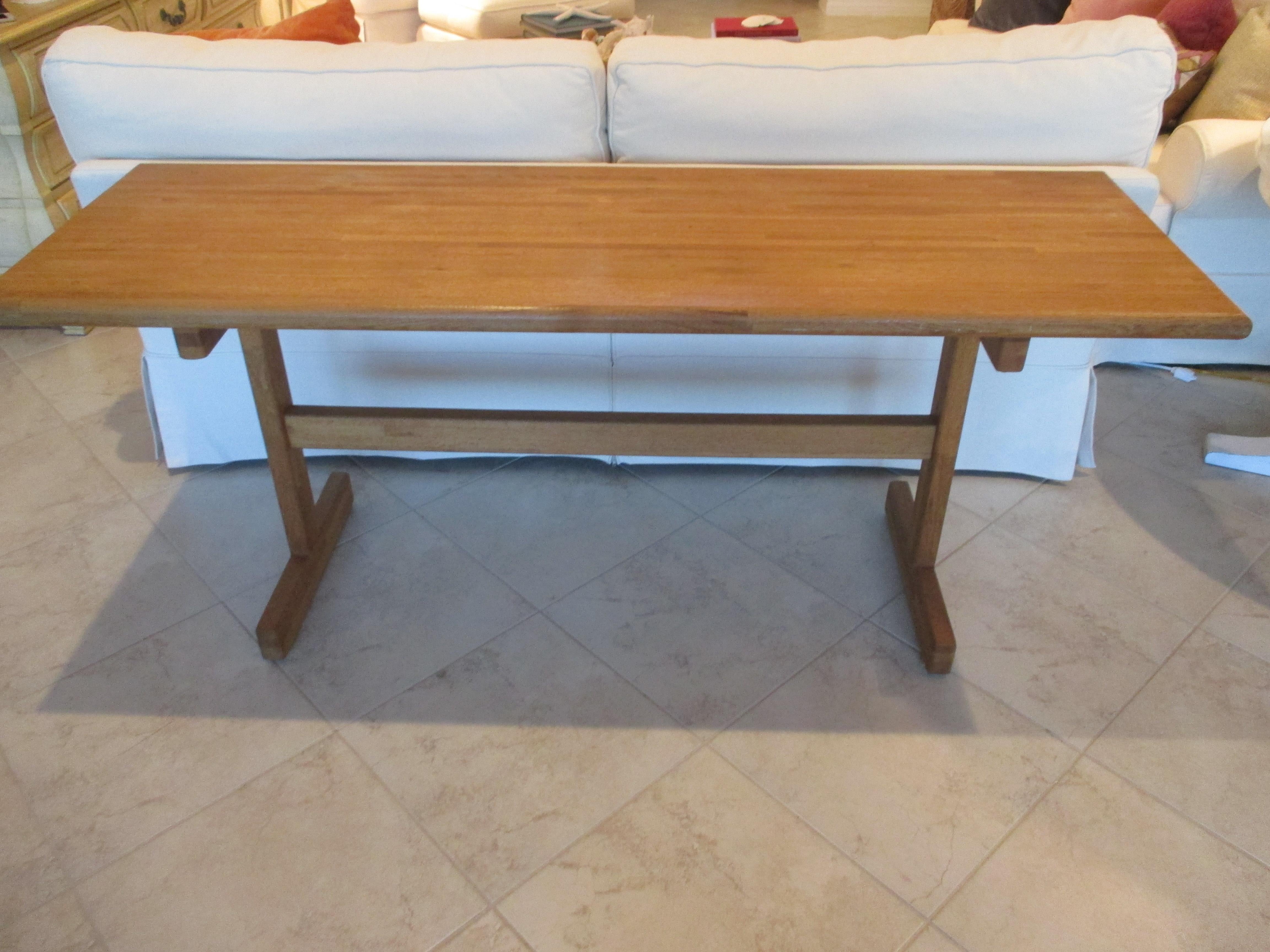 Vintage wood butcher block console with rounded edges and a natural finish. Top measures 1.5