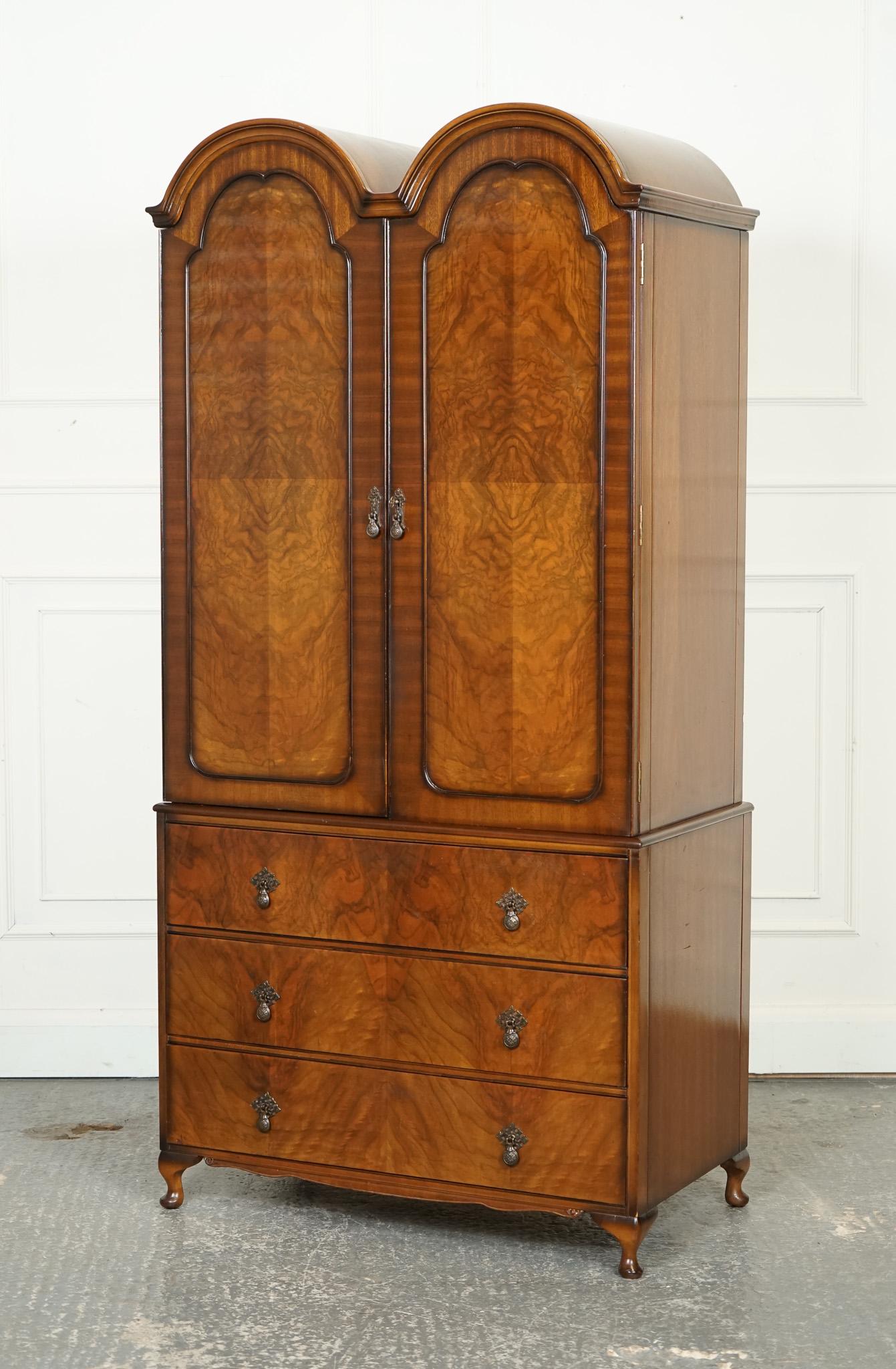 
We are delighted to offer for sale Vintage Butilux circa 1960's Art Deco dome-shaped burr walnut double wardrobe is a stunning example of mid-century design and craftsmanship. This exquisite piece features a unique dome shape that is characteristic
