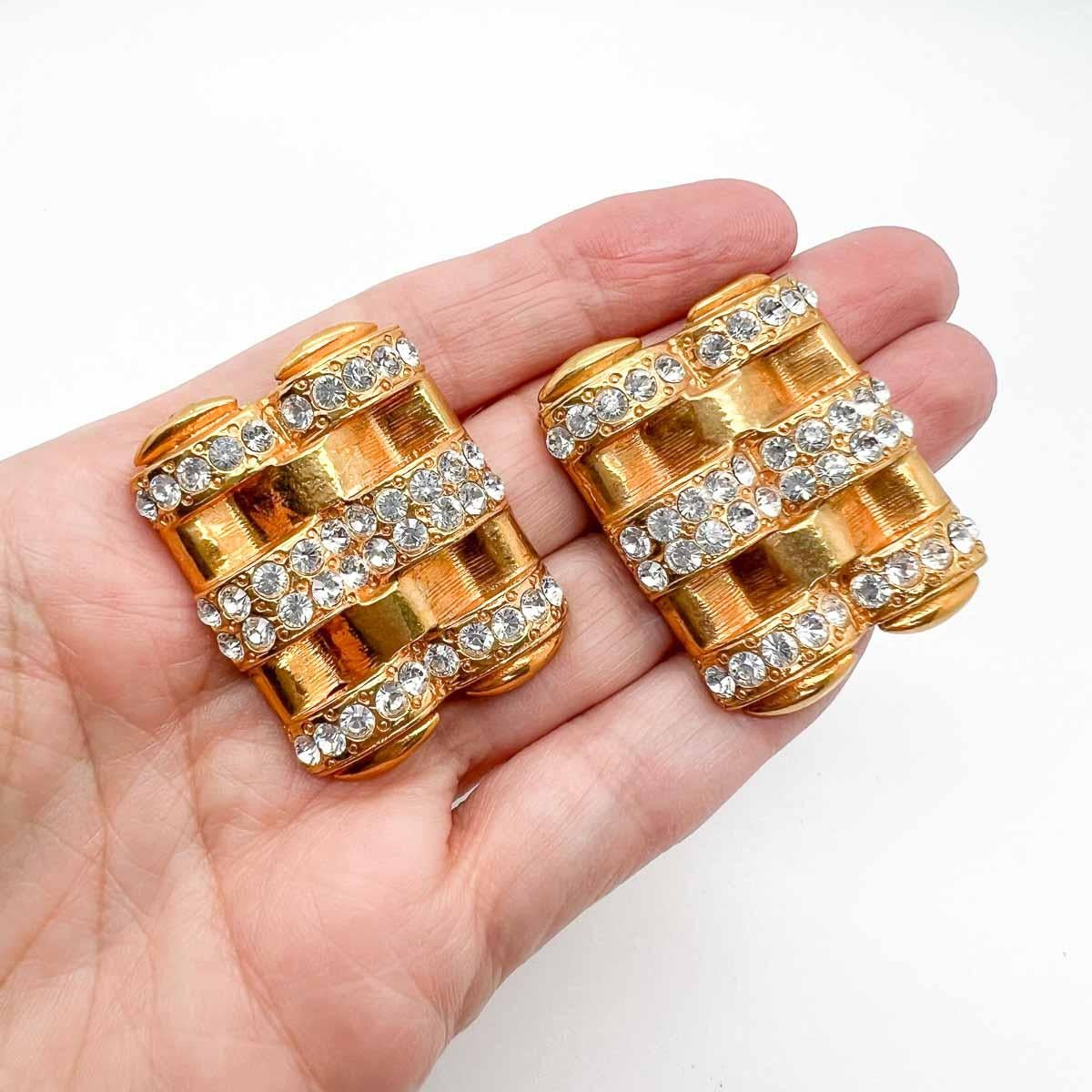 Fabulous style from Butler & Wilson with these Vintage Butler & Wilson Deco Earrings. A large deco style plaque is set with a trio of crystal bars. A stunning statement earring that will effortlessly transcend day to night for you exuding a look of