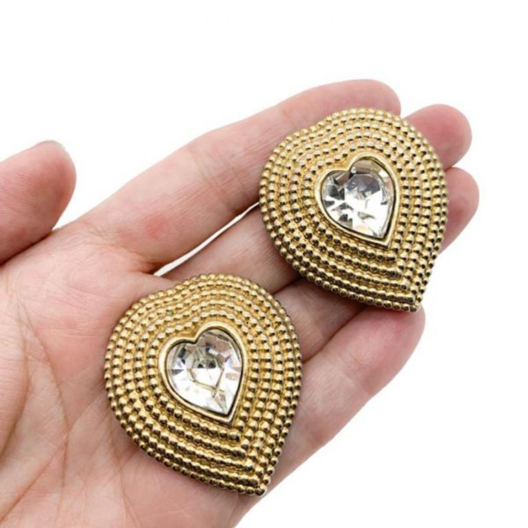 Vintage Butler & Wilson, London, Heart Earrings. Statement sized heart earrings crafted from gold tone metal and set with large sparkly fancy cut crystal hearts. In very good vintage condition with only slight plate wear to the backs. Approx 4.4cm