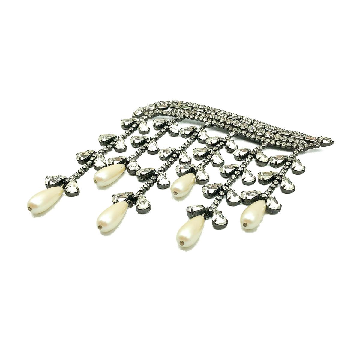 A magnificent and very large Butler & Wilson Pearl Cascade Brooch. Featuring a long pin set with crystals dripping with six glorious lines of claw set crystals and pearl droplets.  In very good vintage condition, signed, approx. 11cm by 13cm. A