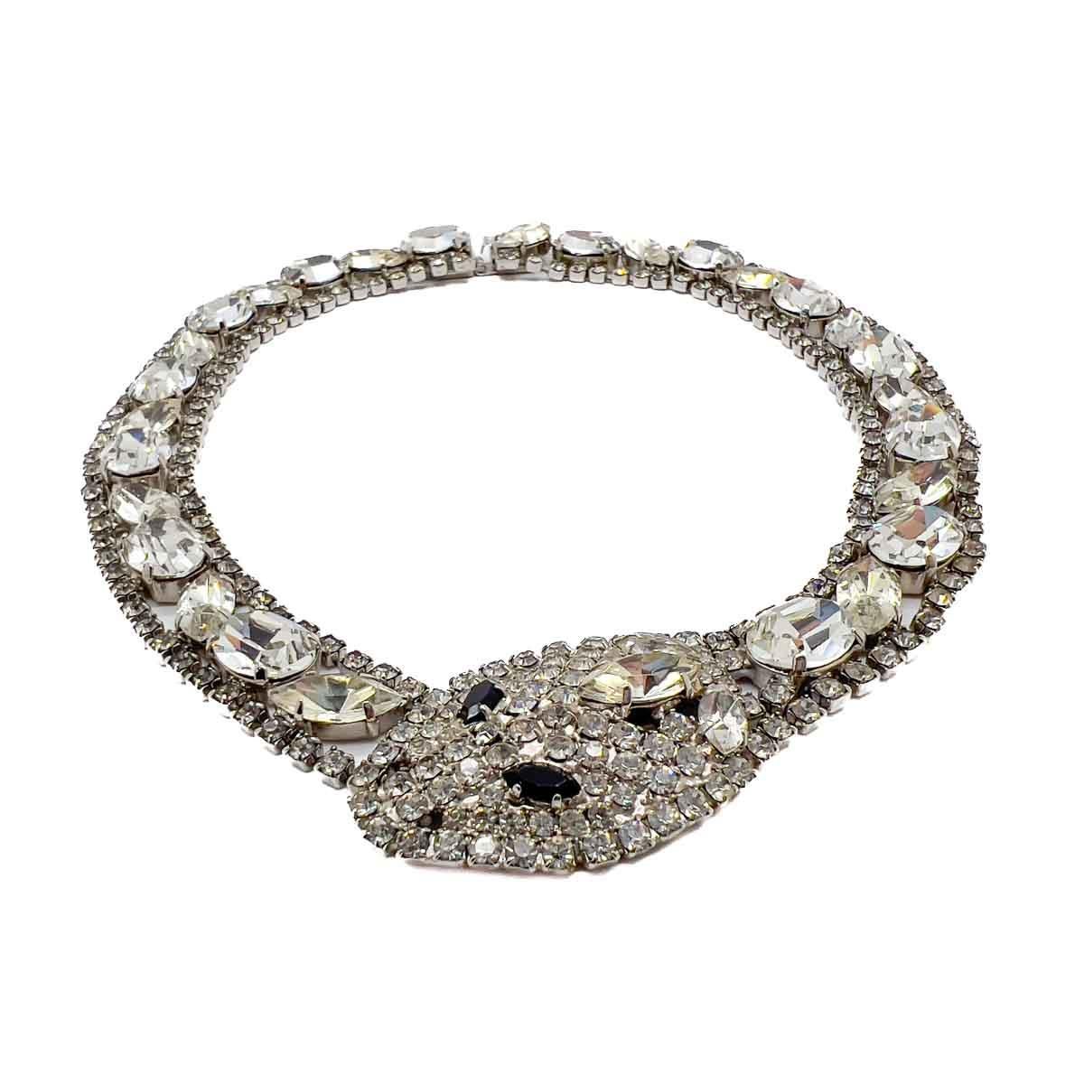 A Vintage Butler & Wilson Snake Collar from the 1980s. A dramatic riviere of fancy cut stones creates our wonderful serpent collar that winds fully around the neck to wonderful effect. Claw set marquise and oval crystals edged with chatons creating