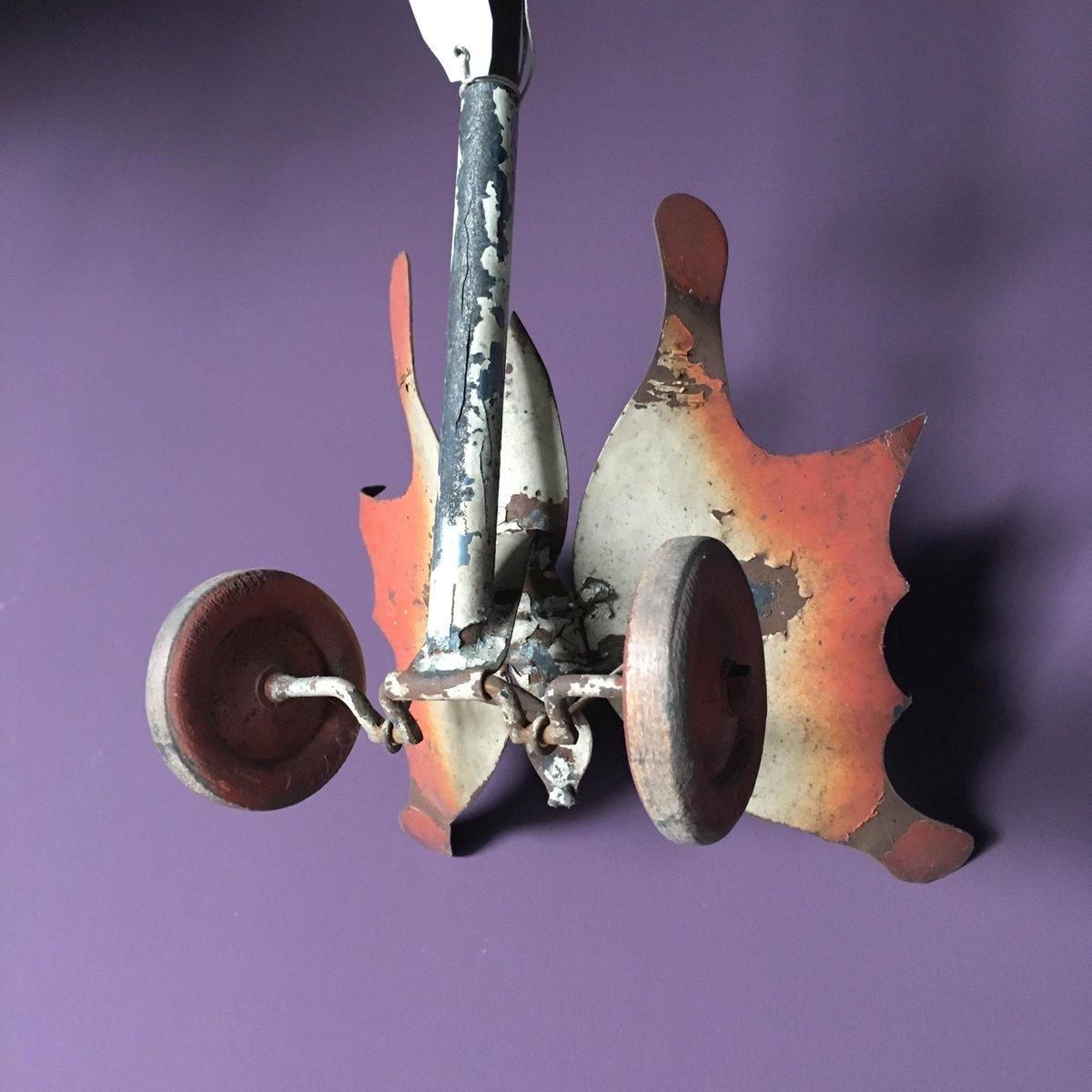 This butterfly metal toy originates from France, 1920s.