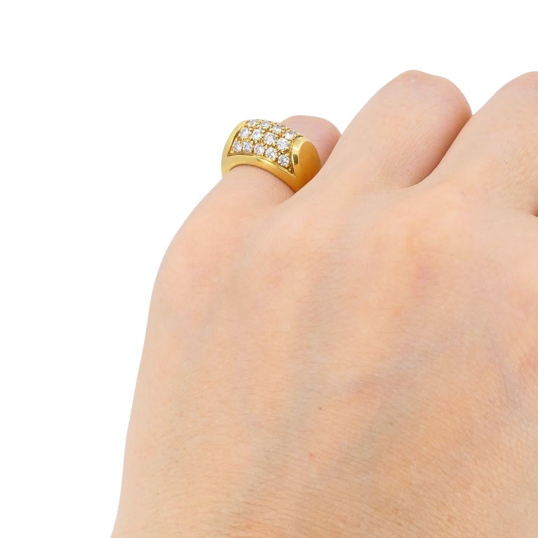This vintage Bulgari Tronchetto ring captures the bold, architectural style that defines the House’s iconic late 20th-century designs. Crafted in solid 18k yellow gold, the ring features a squared top set with brilliant-cut diamonds in pavé