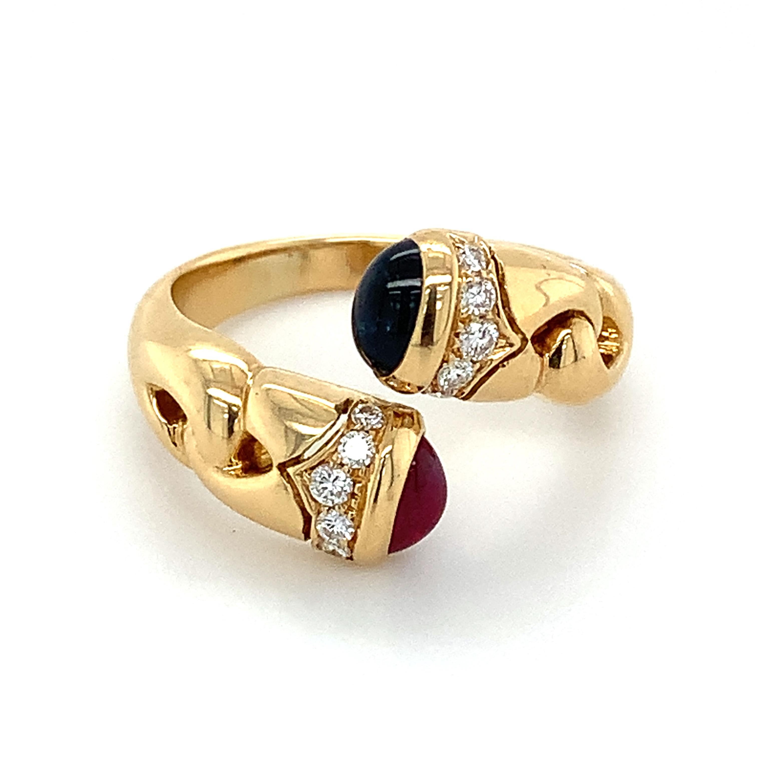 Bvlgari 18k Yellow Gold Bypass Ring
Ring Size 7.25
8.6 Grams
 White Round Brilliant Cut Diamonds 
Color: E-F
Clarity: VS1
Cabochon Sapphire
Cabochon Ruby

This is a beautiful vintage Bvlgari bypass ring showing off these beautiful gemstones. If you