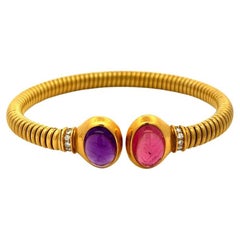 Bvlgari Bracelet tubogas vintage en or jaune 18 carats avec améthyste rose, tourmaline et diamant