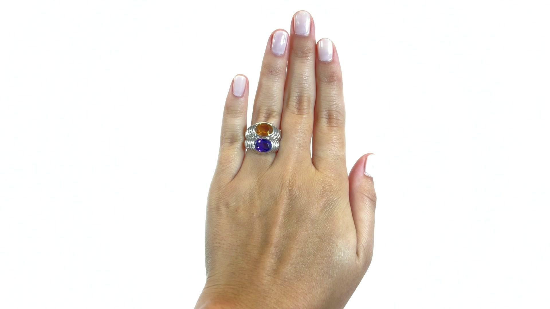 Vintage Bvlgari Amethyst Topaz 18 Karat White Gold Ring. The ring features an amethyst approximately 1.50 carat, an oval topaz approximately 2.00 carat. Signed Bvlgari with Italian hallmarks. Circa 2000s. Size 5 3/4 and may be resized.

About The