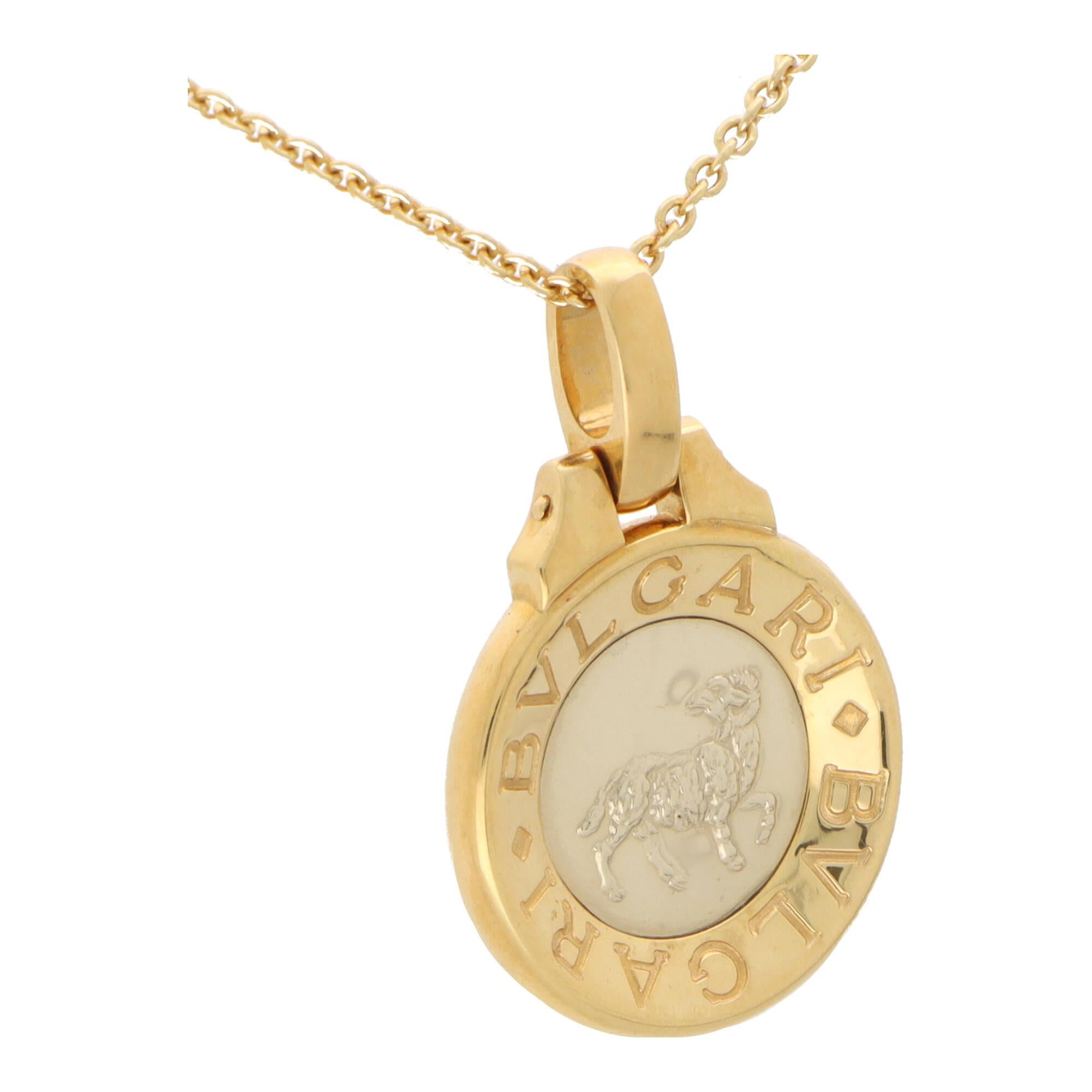 A stylish vintage Buvgari Aries Zodiac pendant in 18k yellow gold and stainless steel.

The piece is firstly composed of a circular medallion which is set to the centre with stainless steel panel. Engraved in the stainless steel is a lion,