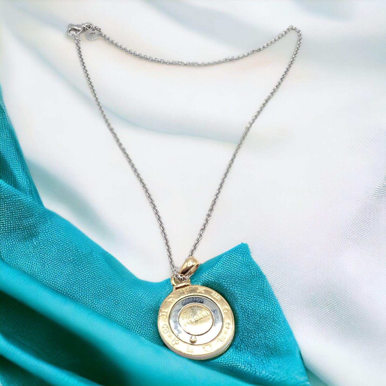 18k yellow & white gold and stainless steel vintage diamond Horoscope Zodiac pendant necklace by Bulgari.
This authentic Bulgari necklace combines 18k yellow gold with stainless steel, featuring an adjustable zodiac pendant adorned with a diamond