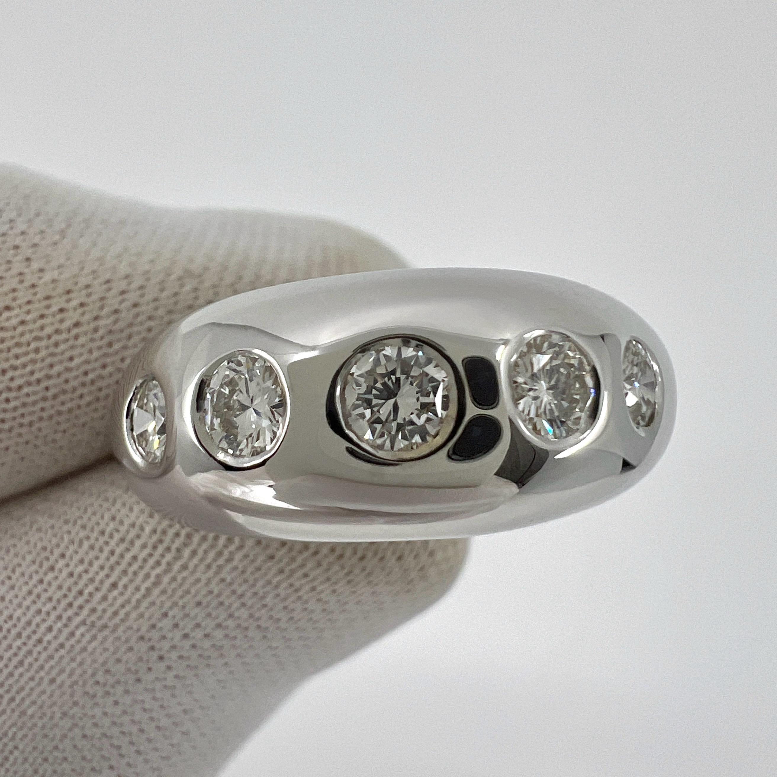 Vintage Bvlgari Flush Set Round Diamond 18k White Gold Dome Ring.

Stunning white gold Bvlgari ring set with five top quality natural round brilliant cut diamonds.
These measure 3.2 - 3mm with superb D-F Colour and VVS clarity. Approx. 0.55 carat