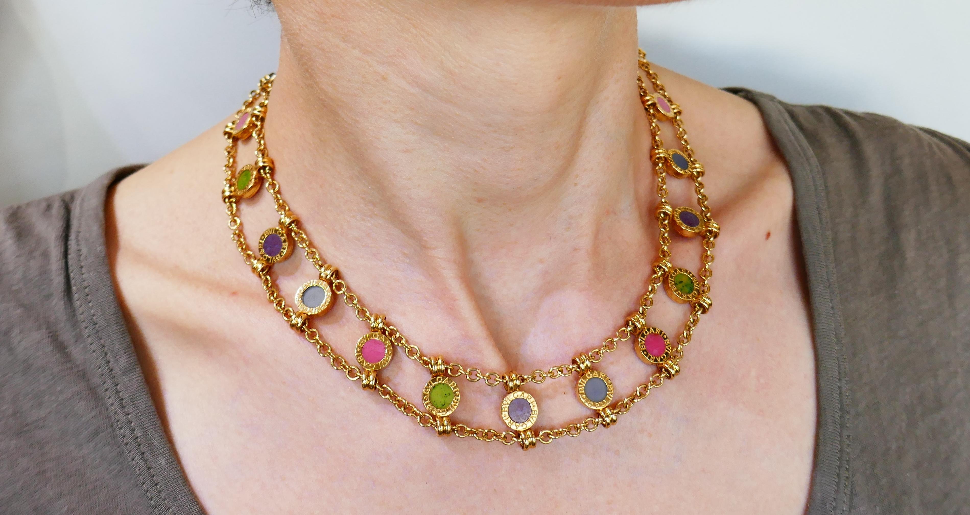 Fabulous colorful necklace created by Bvlgari in Italy in the 1980s. 
Made of 18 karat yellow gold and set with various gemstones. 
Measurements: 15-3/4 x 3/4 inches (40 x 1.8 cm).
Weight 78.1 grams.
Stamped with Bvlgari maker's mark, hallmark for
