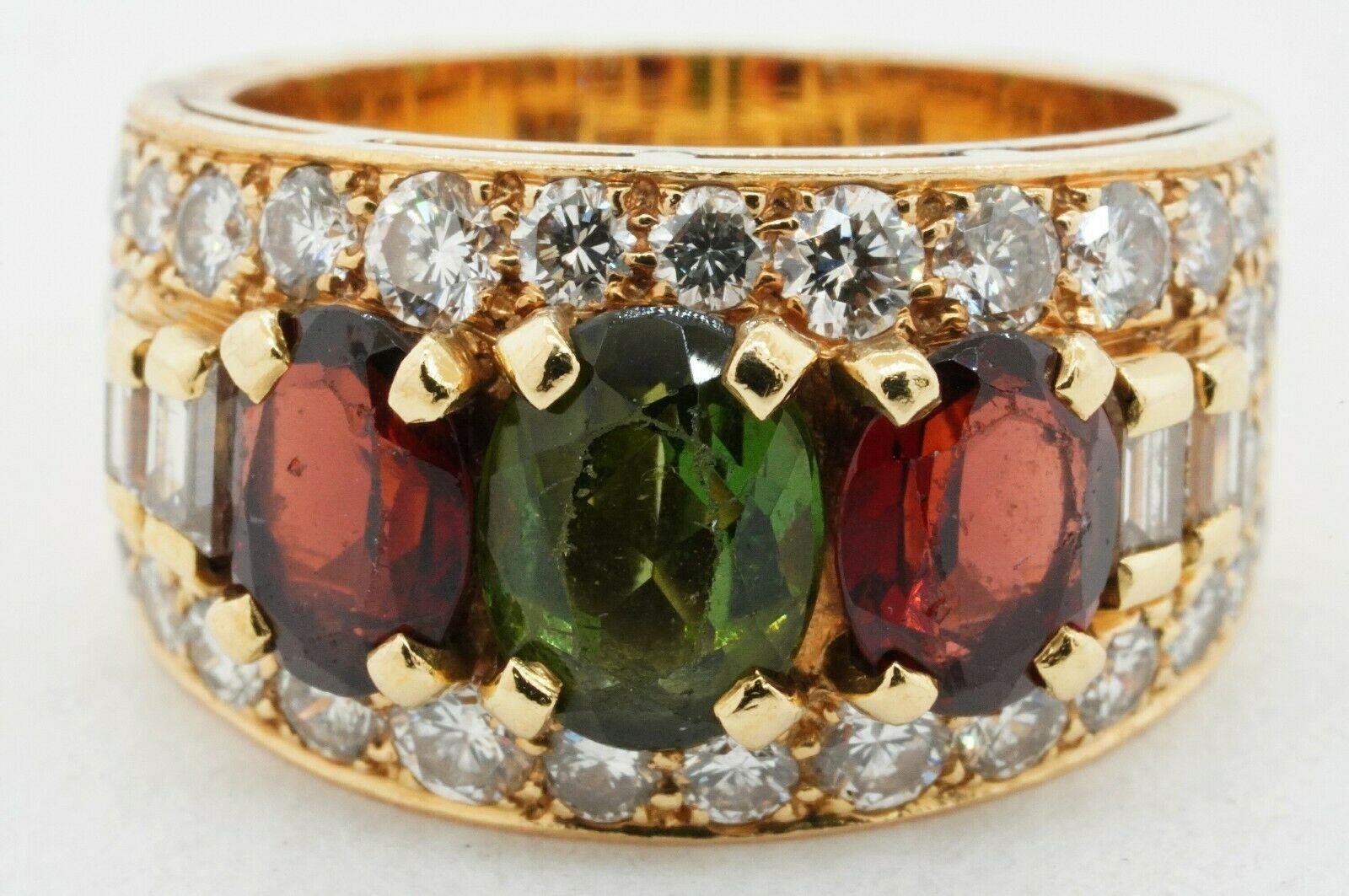 Vintage Bvlgari heavy 18K YG 5.50CT VS1/F diamond & tourmaline ring size 6.25. This alluring piece of jewelry is crafted in beautiful rich 18K yellow gold and features 3 genuine Red & Green tourmaline gems with a combined weight of approx. 2.50CT,