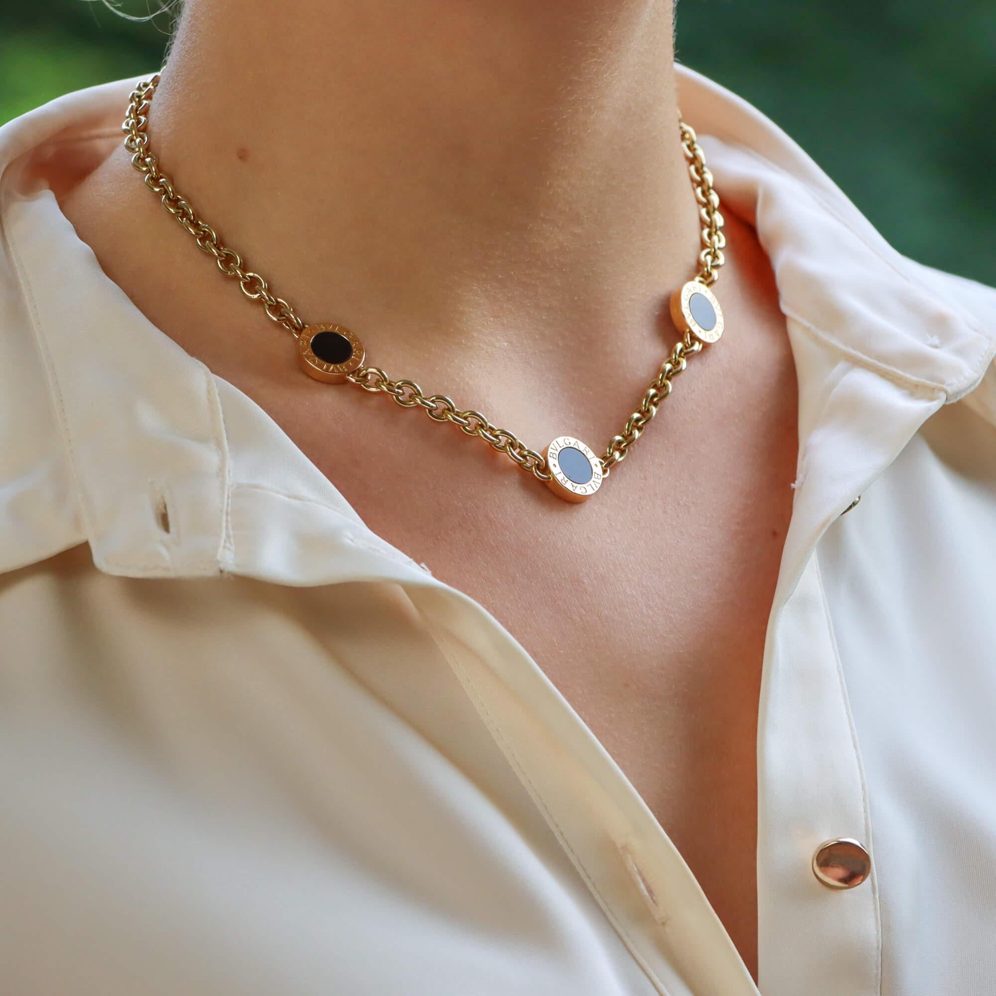 A stylish vintage Bvlgari onyx disc chunky chain necklace set in 18k yellow.

From a now discontinued design in the ‘Bvlgari Bvlgari’ collection, the necklace is composed of three yellow gold and onyx discs, engraved in the border with the brands