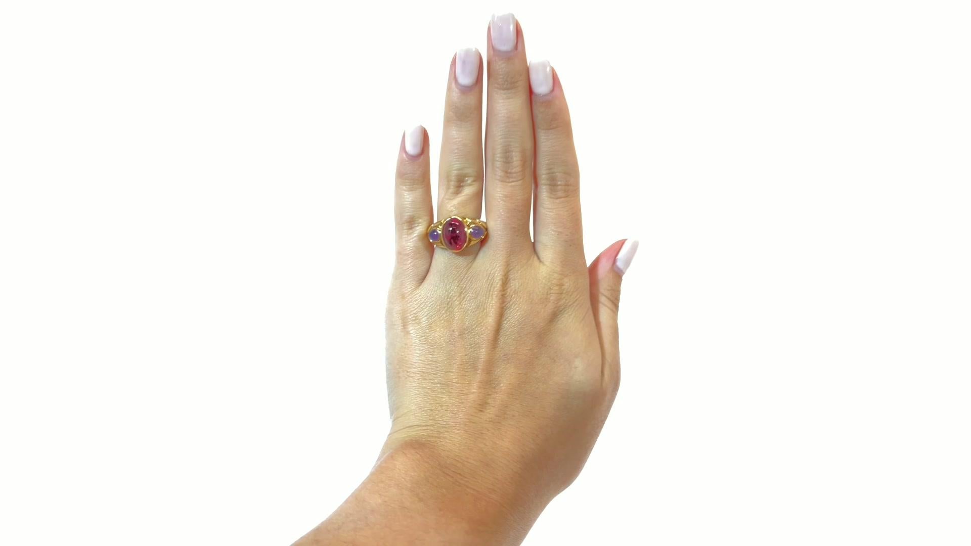 Vintage Bvlgari Ruby Amethyst Gold Ring. Featuring cabochon cut ruby approximately 5.80 carat, two cabochon cut amethysts approximately 0.70 carat total. Signed Bvlgari with Italian hallmarks. Circa 1990s. Size 5 1/4 and may be resized.

About The