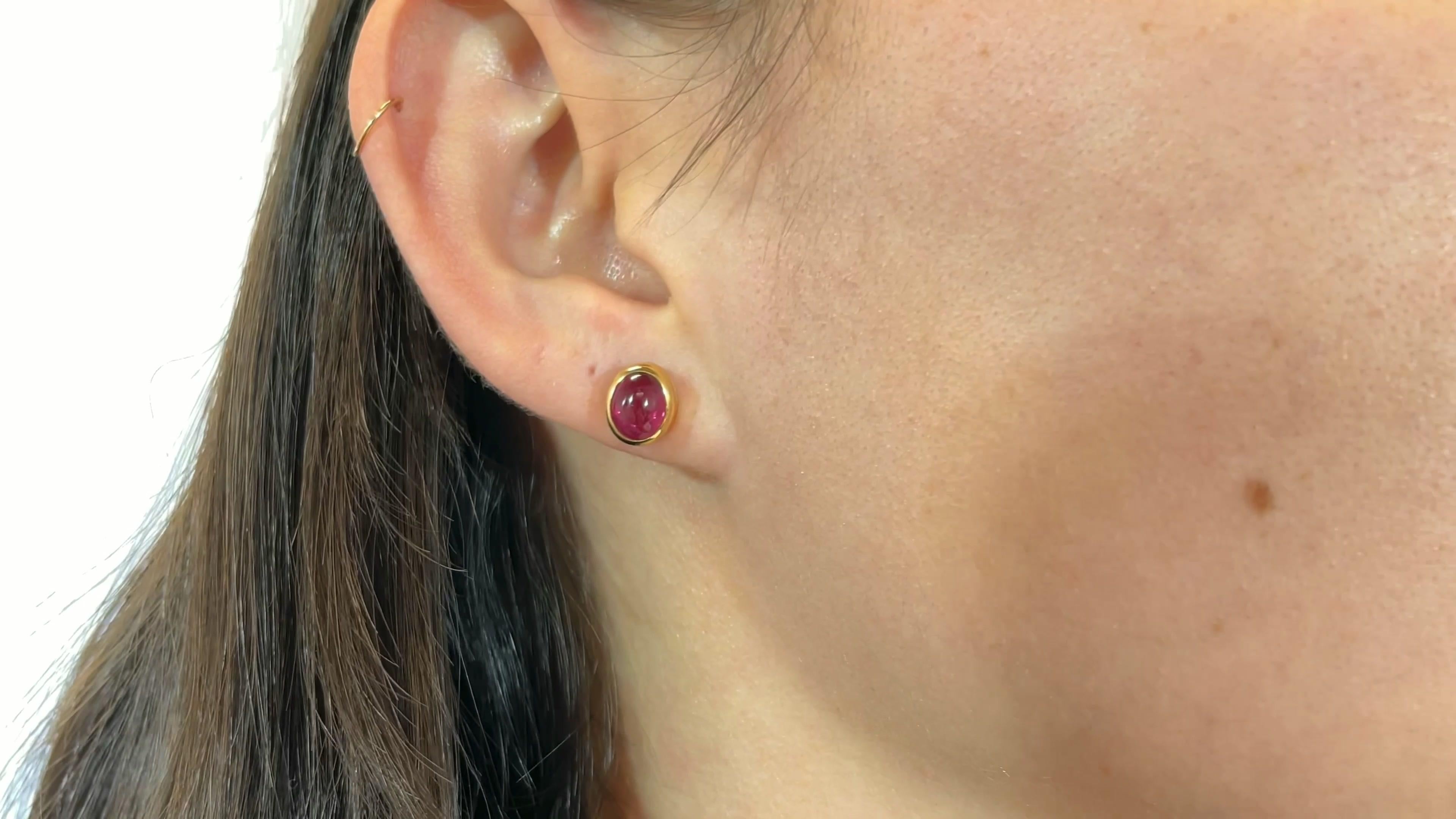 Vintage Bvlgari Ruby Gold Stud Earrings. Featuring 2 ruby cabochons approximately 4.00 carat total. Signed Bvlgari with purity mark. Circa 1990s.

About The Piece: Bvlgari designer house is known for using bold colors and juicy gems. Become the