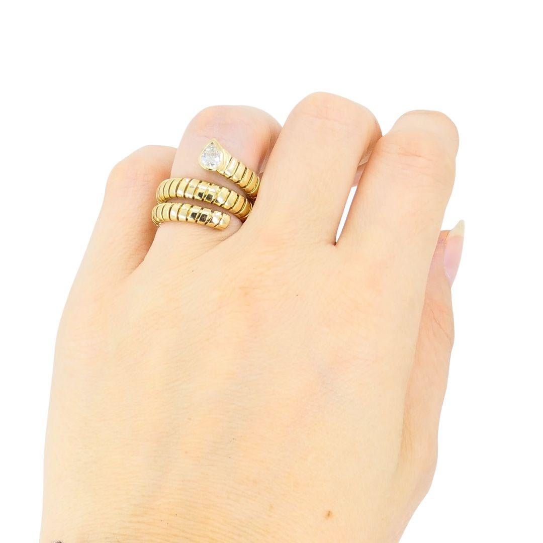 DESIGNER: Bvlgari
CIRCA: 1980’s
MATERIALS: 18K Yellow Gold
GEMSTONE: Pear cut Diamond
WEIGHT: 14.2 grams
RING SIZE: 6-7
HALLMARKS: BVLGARI, 750, Serial Number

A beloved Serpenti Tubogas rign by Bvlgari, made of 18k gold, features a pear cut