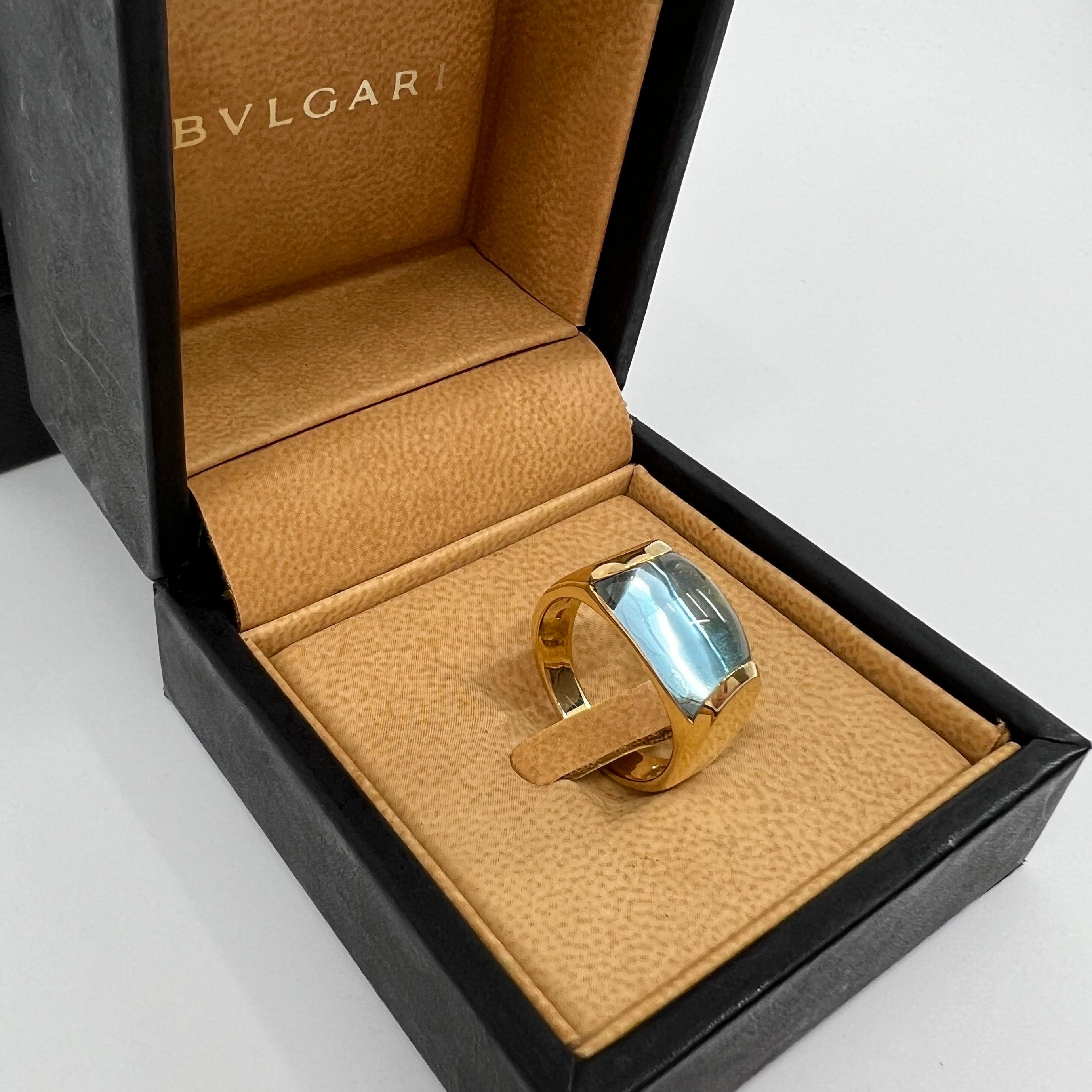 Vintage Bvlgari Tronchetto Or jaune 18k Topaze bleue Bague dôme.

Magnifique topaze bleue bombée sertie dans une bague en or jaune 18 carats sertie en tension. Bague audacieuse et éblouissante de la collection Bvlgari Tronchetto.

En excellent état,