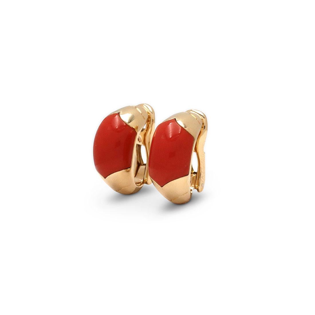 Authentic vintage Bvlgari 'Tronchetto' earrings crafted 18 karat yellow gold. The earrings are set with coral and feature clip back closures that can be converted to posts. The earrings measure 19.5mm in length and 9.5mm in width. Signed, Bvlgari,