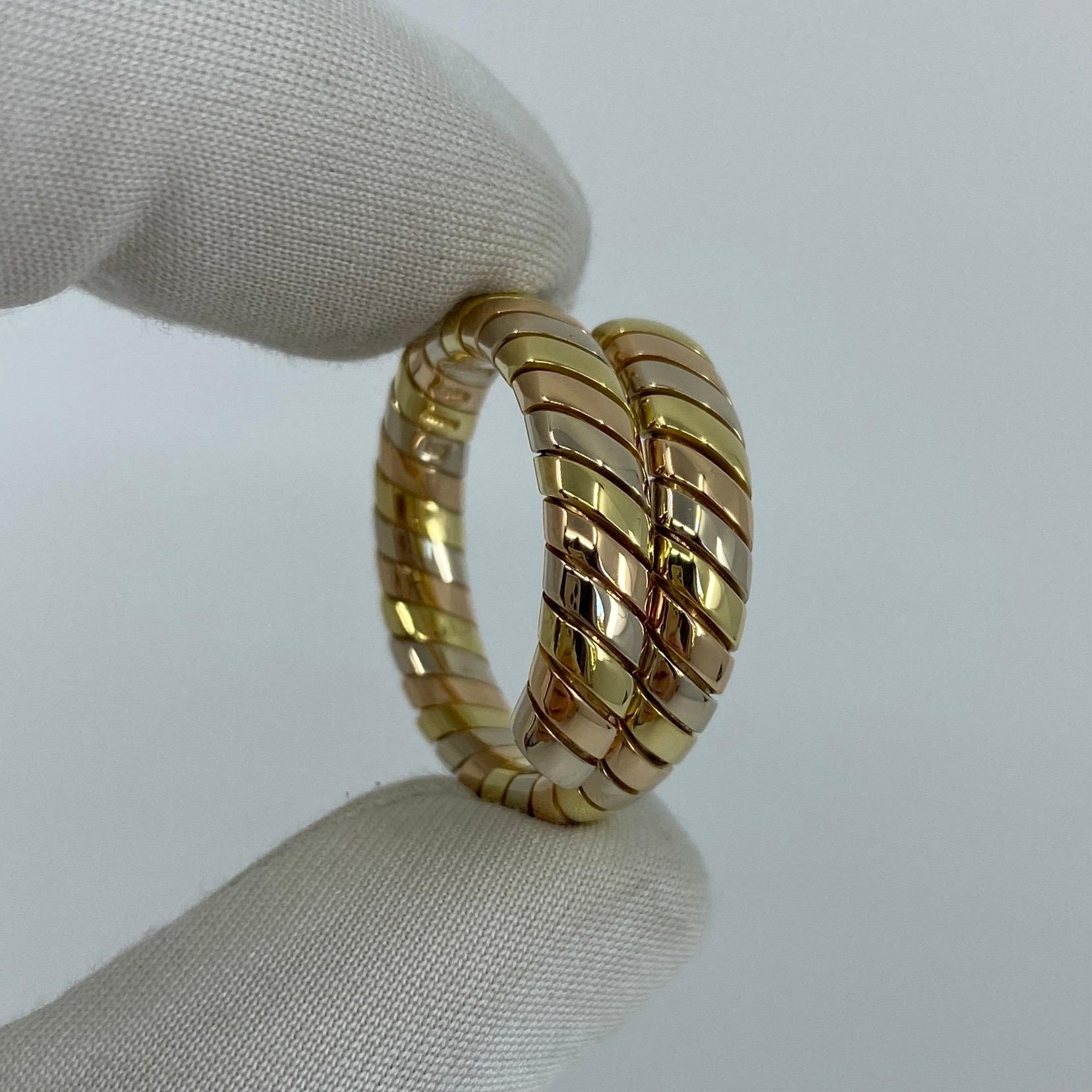 Vintage 18k Tricolour Gold Bvlgari Tubogas Flexi Ring.

This stylish design features alternating bands of white, yellow and rose gold tapering up to two rows on a flexi band. A rare and sought after vintage bvlgari piece.
In excellent condition, has