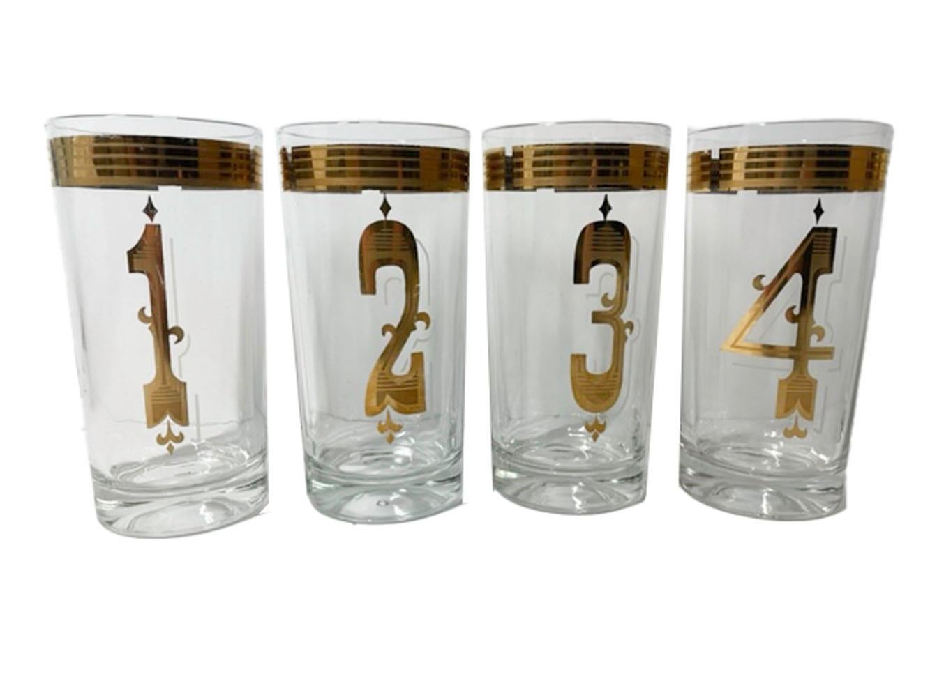 Rare set of eight vintage highball glasses with 22k polished and satin finish gold numbers below a rim band, the Art Deco style numbers with white frosted shadow.