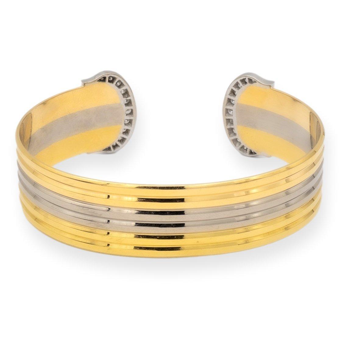 Vintage Cartier Trinity Open Cuff Bracelet from the esteemed C de Cartier collection. Crafted in the 1980s, finely crafted in 18K yellow, white, and rose gold, showcasing the iconic Double C ends that signify Cartier's enduring legacy. Embellished