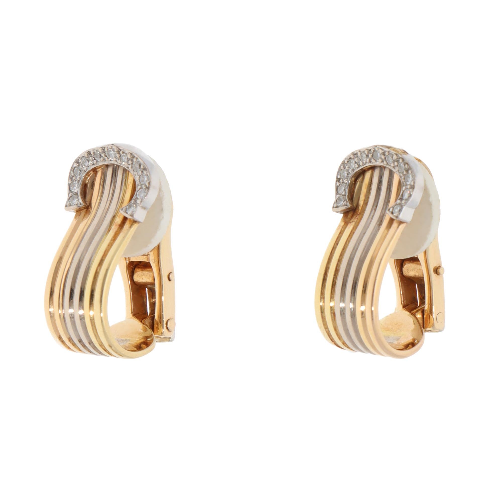 A beautiful pair of vintage C de Cartier diamond hoop clip earrings set in 18k yellow, rose and white gold.

From one of the iconic Cartier collections, each earring is made of six solid soldered tricoloured bands. These bands flow round nicely to