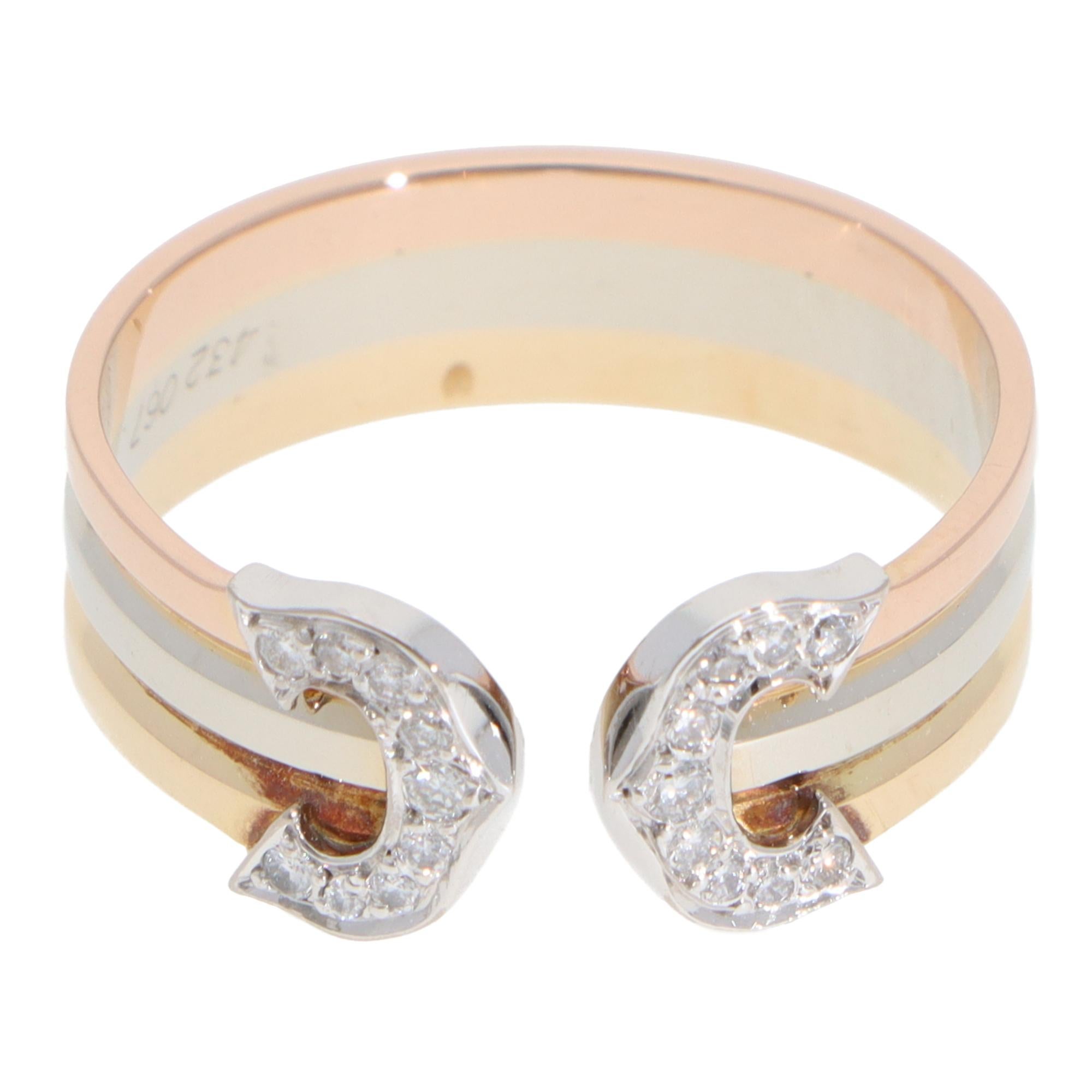 A classic vintage C de Cartier diamond open band ring set in 18k rose, white and yellow gold.

The piece is from one of the iconic Cartier collections. The ring is made of three solid soldered tricoloured bands. These bands flow round nicely to the