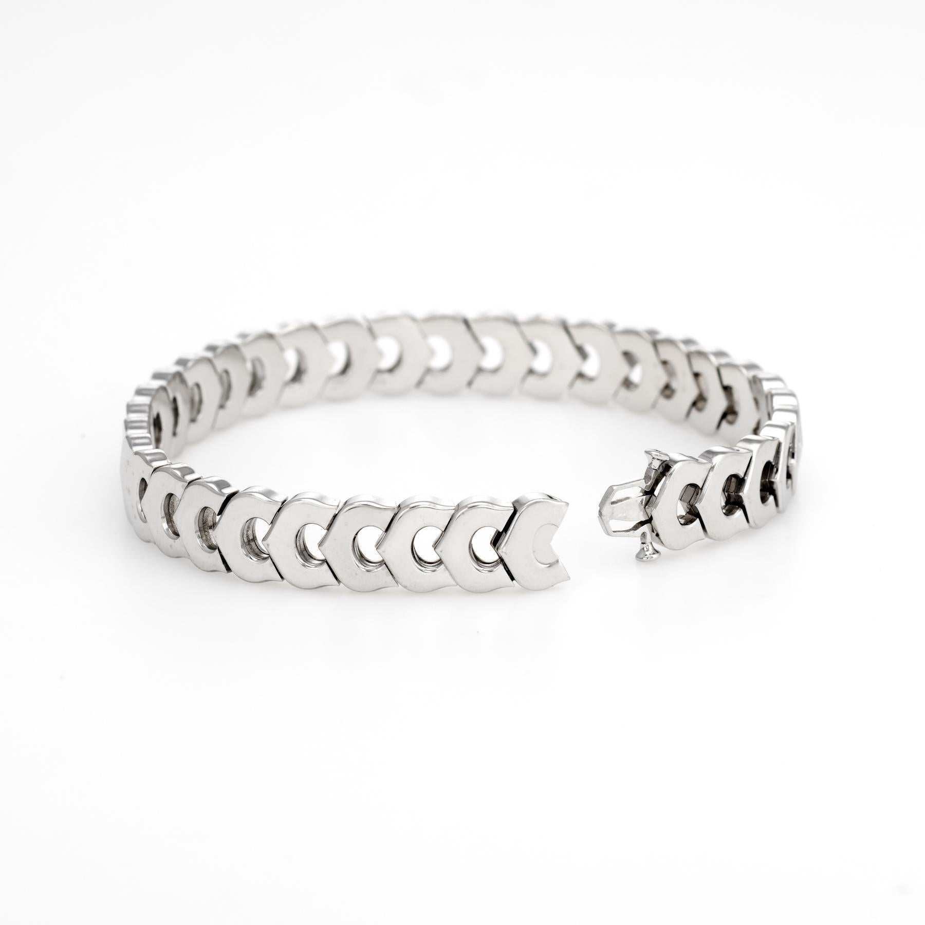 Cartier 'C' logo bracelet, crafted in 18 karat white gold.  

The classic 'C' link bracelet is circa 1980s to 1990s. Great worn alone as a statement bracelet or layered for the ultimate wrist stack. 

The bracelet is in excellent original condition