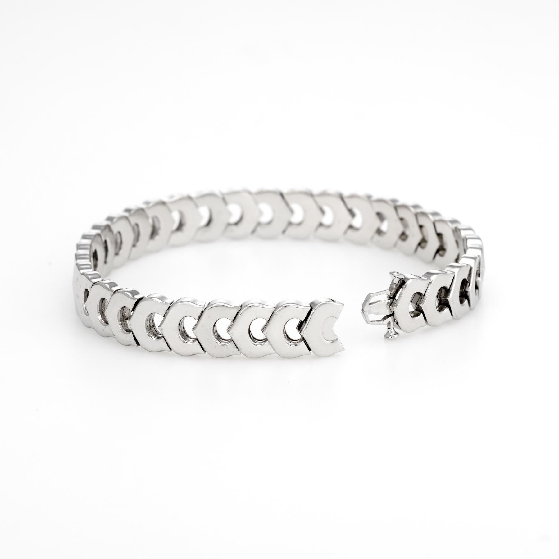 Cartier 'C' logo bracelet, crafted in 18 karat white gold.  

The bracelet is circa 1980s.

The bracelet is in excellent original condition and was recently professionally cleaned and polished.

Particulars:

Weight: 36.1 grams

Stones:  N/A.

Size