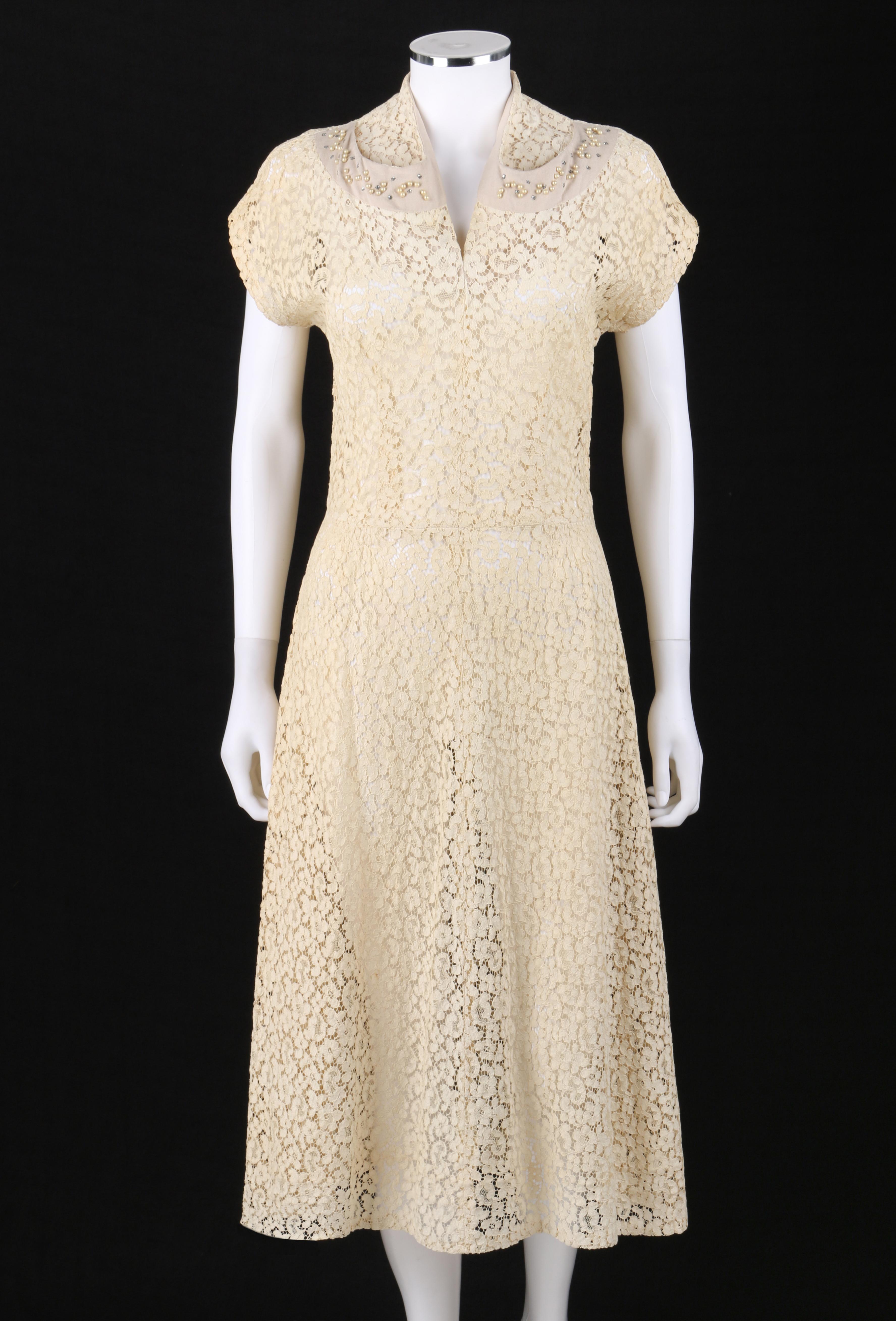 VINTAGE c.1940’s Ivory Tan Cotton Lace Beaded Applique Vent V-Neck Midi Dress  
 
Circa: 1940’s
Label(s): None
Style: Midi dress
Color(s): Shades of ivory and tan 
Lined: No 
Unmarked Fabric Content (feel of): Cotton 
Additional Details /