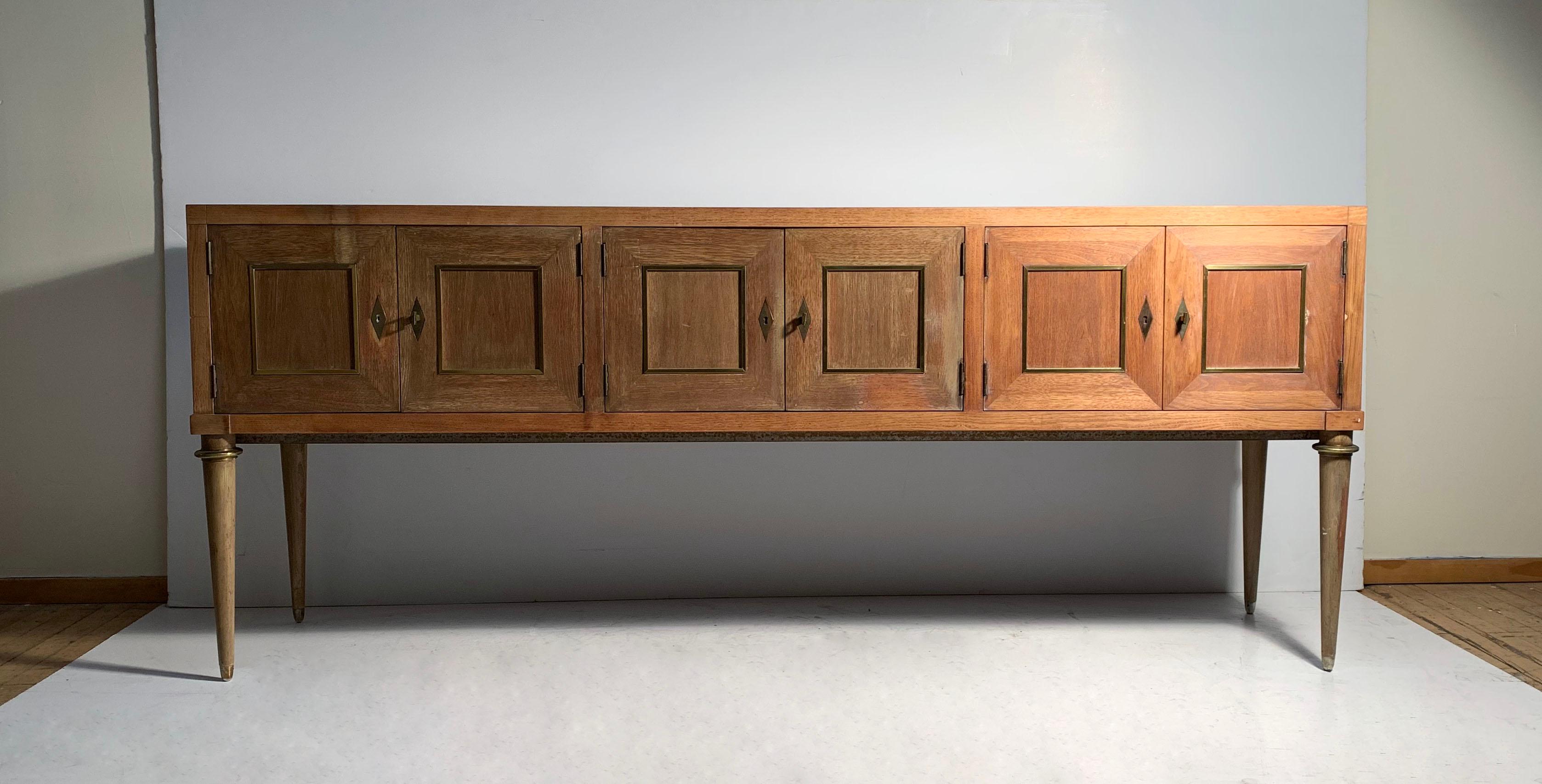 An unusual and desirable sized cabinet credenza console by Bernhard Rohne for Mastercraft in the French Directoire Hollywood regency Deco style.  In the manner of Wormley for Dunbar & Tommi Parzinger.

The finish is weathered and may possibly be ok